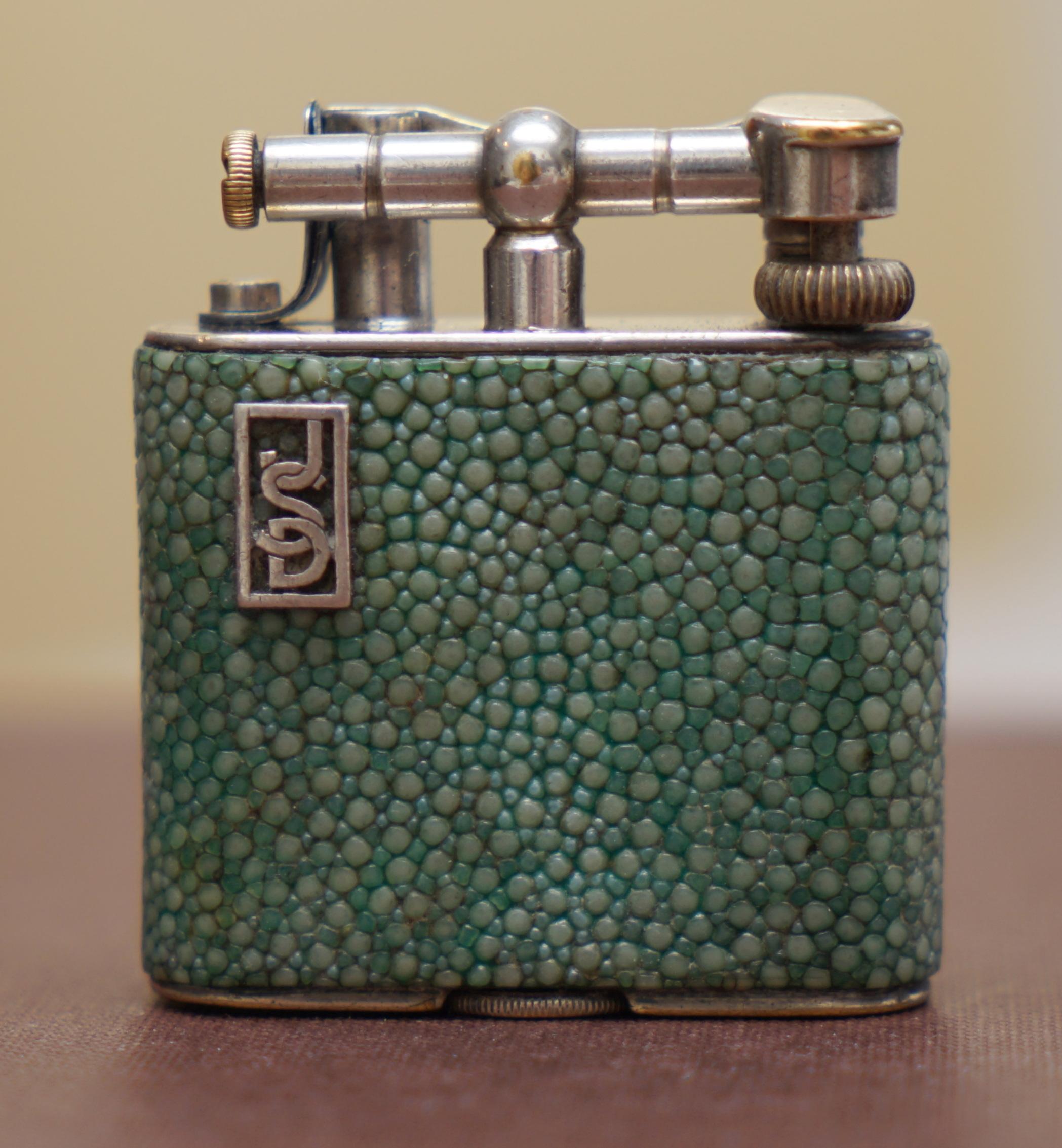 We are delighted to offer for sale this stunning antique Dunhill Shagreen lighter

A very rare good looking and functional piece of collectible smoking equipment. Shagreen is exceptionally collectible on its own, it is Sharkskin and very