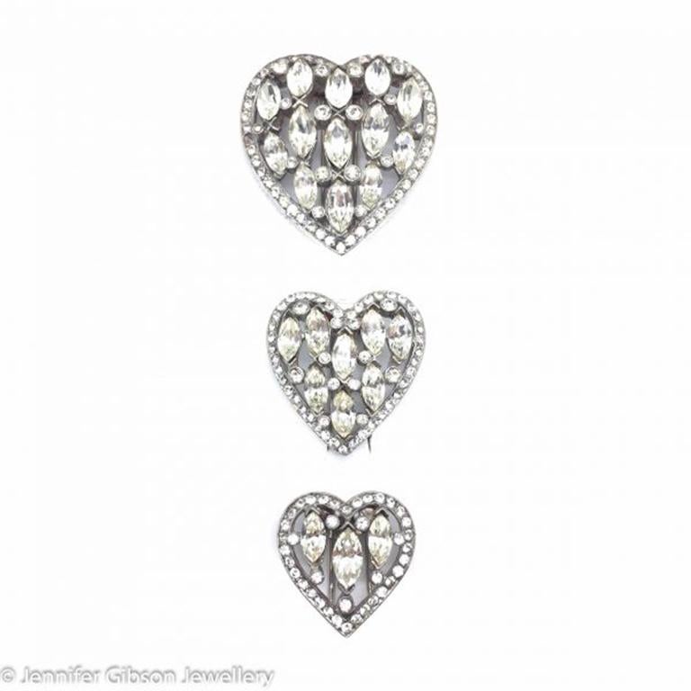 Out of this world! A trio of pins in heart shapes and set with beautiful crystal marquis stones, likely Swarovski crystals, in a pewter colored metal.  This suite of vintage 1930s Eisenberg heart pins would have been in women's furs during the 1930s
