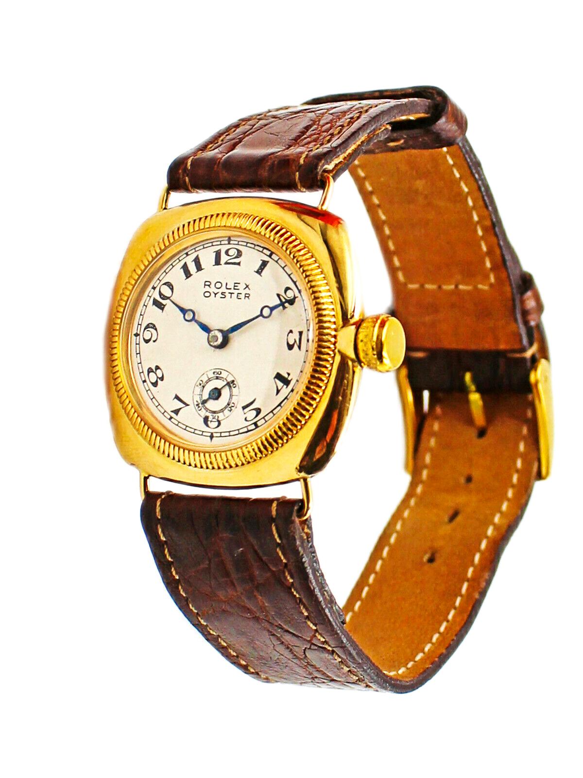 The present watch is a very rare 18kt yellow gold Rolex Oyster Cushion Shaped Officers wristwatch with Sub Second dial located at the 6, circa 1930s

The Case dimensions are as follow  28mm x 28mm
The movement, case, dial and buckle are all signed