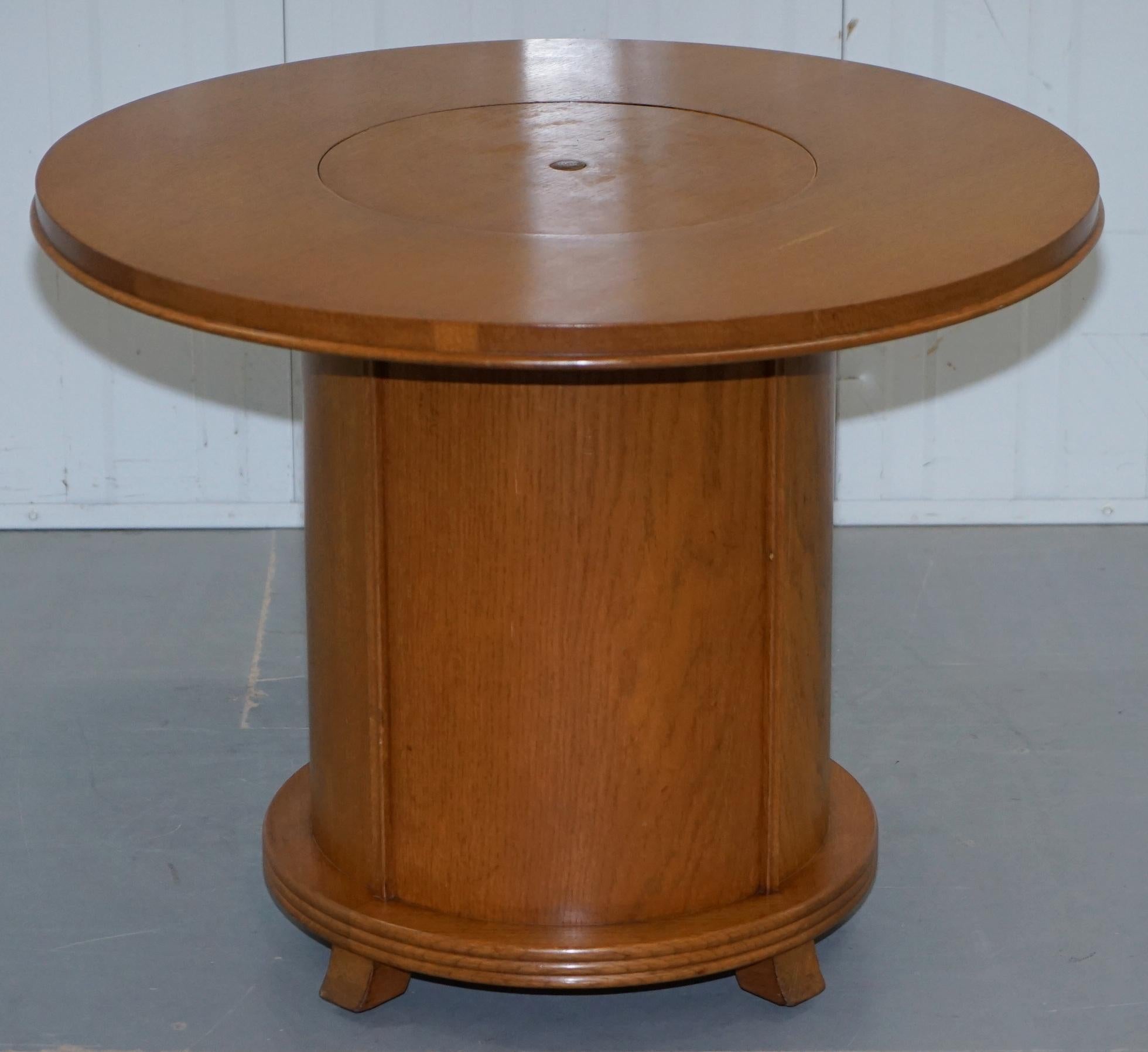 We are delighted to offer for sale this stunning original Art Deco 1930s walnut cocktail table with central rising drinks section.

A very good looking and well made decorative piece, you simply push the middle button and the drinks cabinet