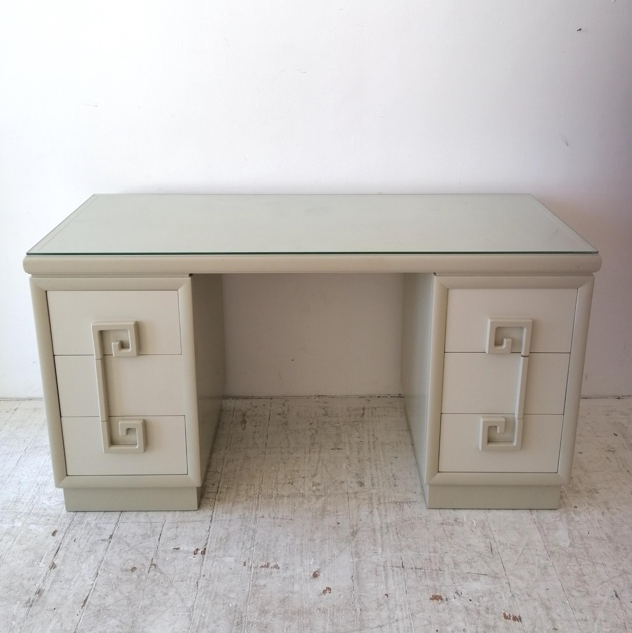 A rare 1940s Hollywood Regency 'Mandarin' desk / dressing table by Kittinger, USA.
Greek key design drawer pulls: 3 drawers each side. Warm grey and ivory lacquer (a little bit of wear- which has been patched with grey paint by previous owner- on