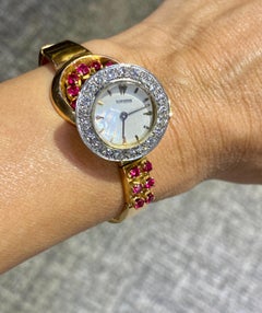 Rare 1940s ruby and diamond 18k gold asymetric watch