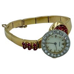 Rare 1940s ruby and diamond 18k gold asymetric watch