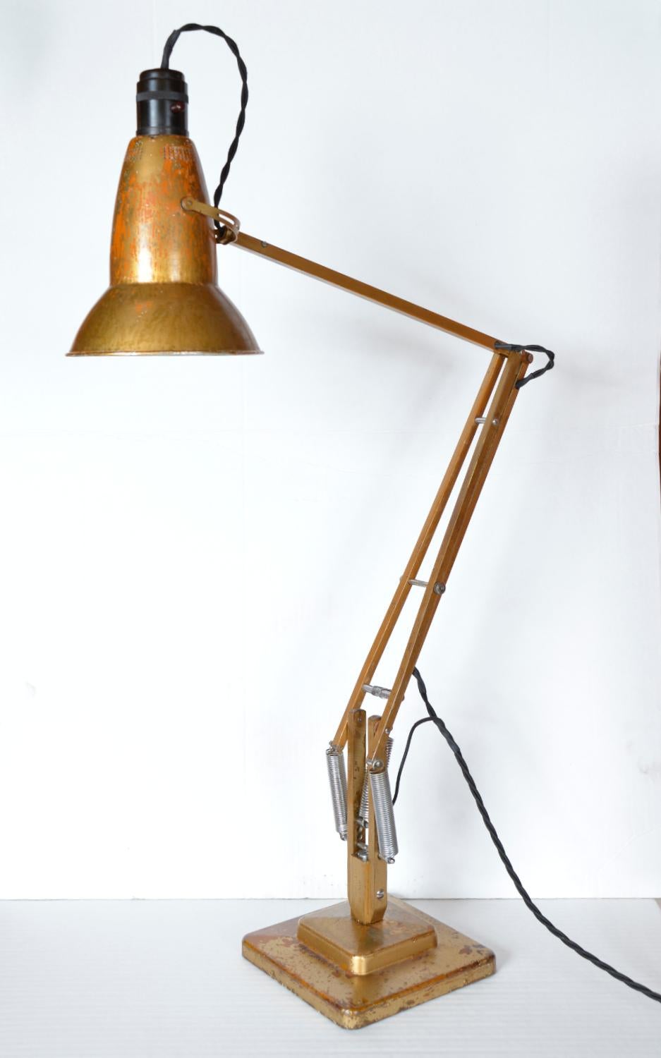 For those who love originality, this early two-step Herbert Terry & Sons Anglepoise lamp (Model 1227) with a slim perforated shade and original gold paint, has the most extraordinary patina - revealing its orange undercoat. Designed by George