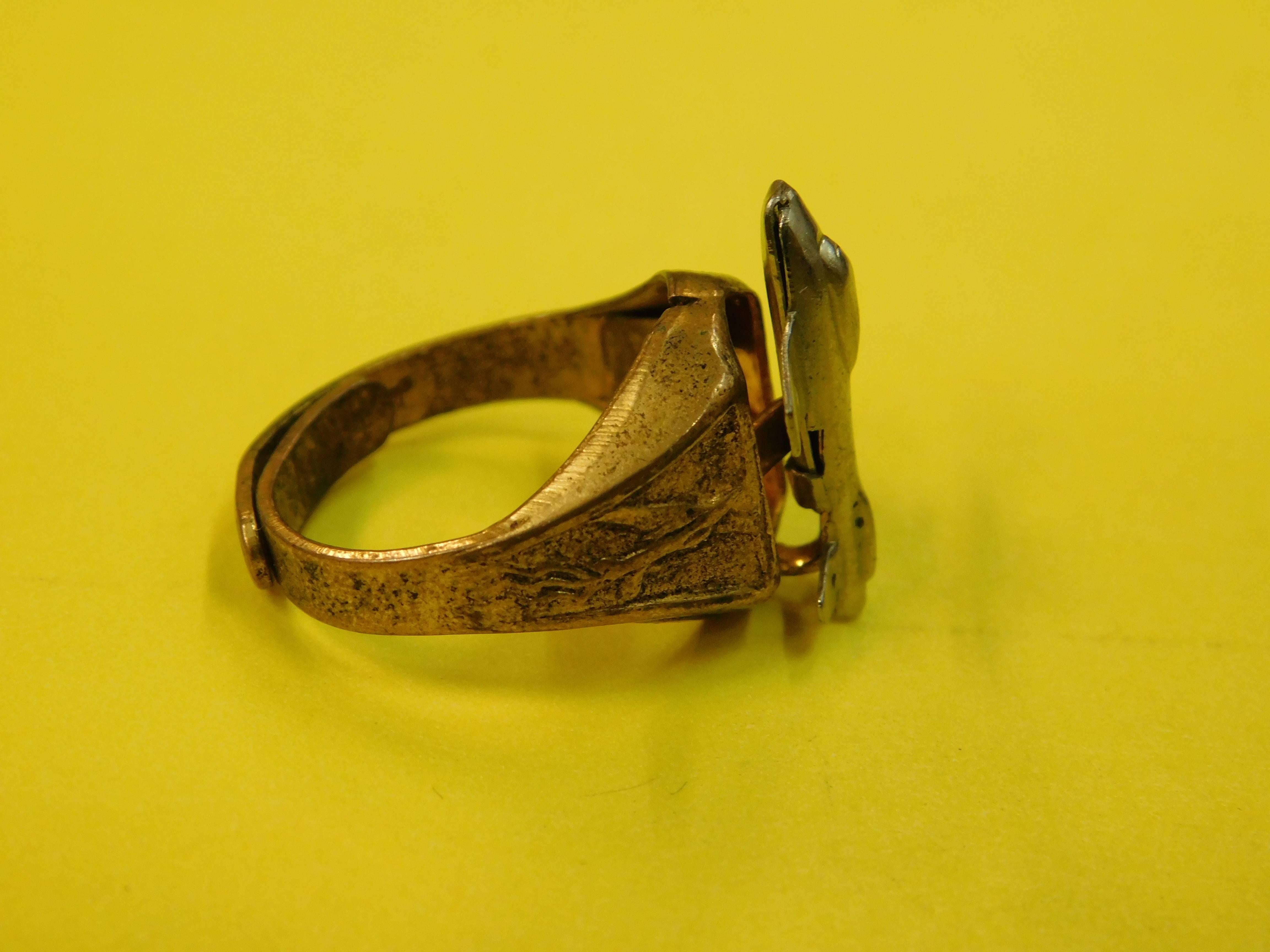 Rare 1948 Kelloggs Pep whole wheat cereal jet ring as advertised on the Superman radio program. The ring with adjustable 24-karat gold plate band has airplane image on each side. Top has nickel finish luster metal spring-loaded airplane which shoots
