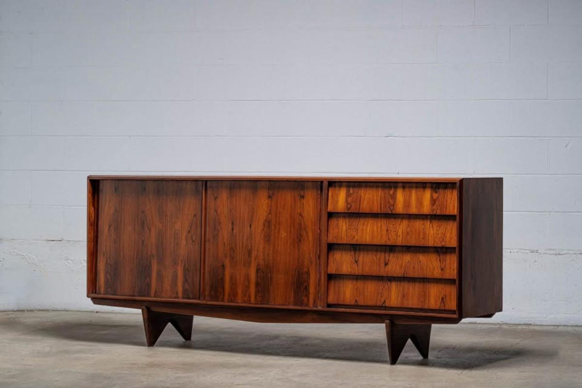 A masterwork of mid-century Brazilian design, this rare and architecturally striking credenza was created by Martin Eisler and Carlo Hauner for Forma in the early 1950s. Entirely handcrafted from richly figured Brazilian rosewood (Jacaranda), the
