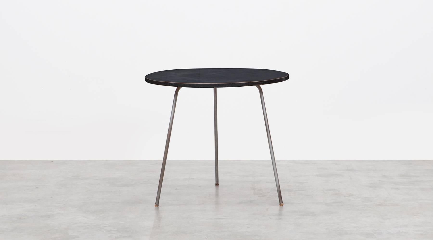 Side table designed by German Egon Eiermann with a wooden top and a metal base. Its simple design with the circular top and the three legs makes it so unique and special. This piece is usable for different living rooms. Manufactured by Wilde and