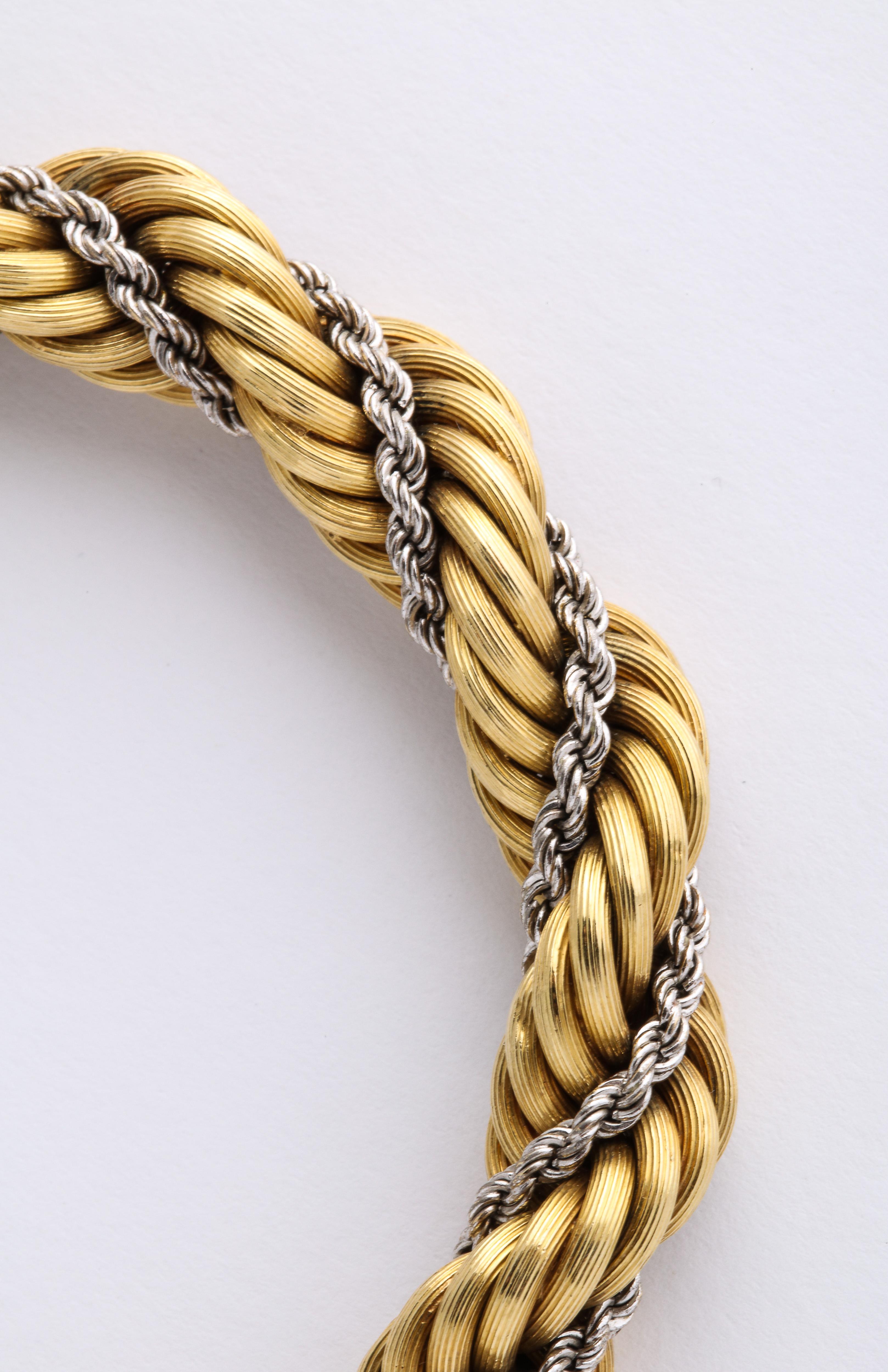 Rare 1950's Cartier Two Tone Gold Rope Twist Chain Bracelet w/ Box 
33 Grams 18k
Stamped 750
Stamped Cartier 18k Italy

