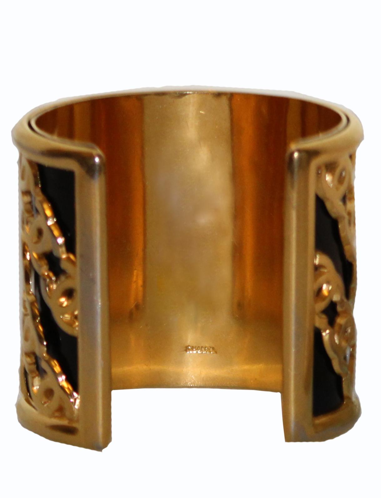 Chanel.  Every woman knows this iconic brand.  In style for over 100 years with no end of interest in sight!  Offering a rare find!  This 1950's gold tone open end cuff is a statement!  1.5