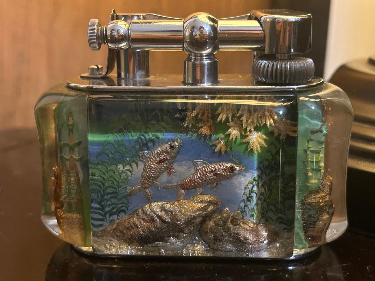 A rare 1950s Half-Giant Dunhill aquarium table lighter (made in England) 

Each of these lighters are very rare and unique as they were hand carved and painted and no one look exactly similar.

Ben Shillingford (1904-2000) commenced to work for