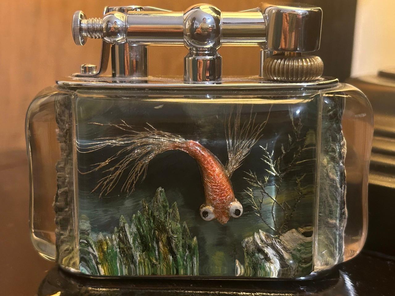 A rare 1950s Half-Giant Dunhill aquarium table lighter (made in England) 

Each of these lighters are very rare and unique as they were hand carved and painted and no one look exactly similar.

Ben Shillingford (1904-2000) commenced to work for