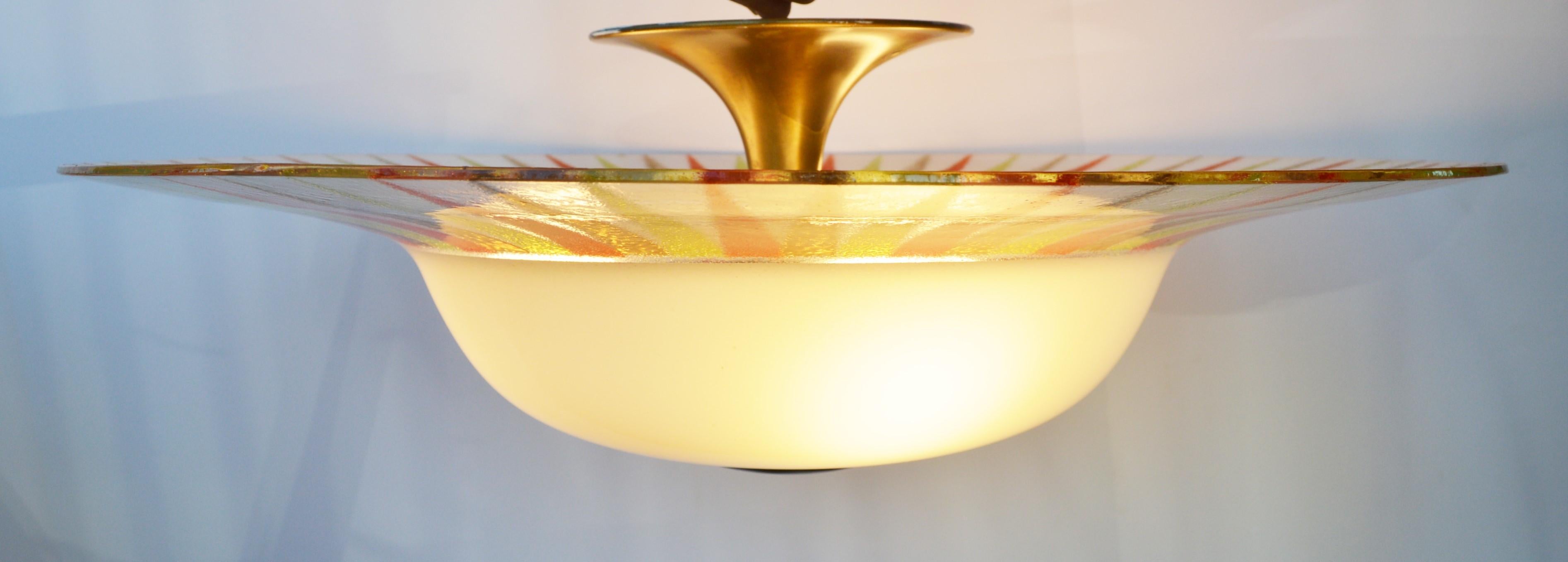 This rare and super dramatic light was designed by Gerald Thurston for Lightolier and still retains the original label as well as an etched number. In amazing condition, with no chips or damage to the glass, Lightolier devised a wonderful technique