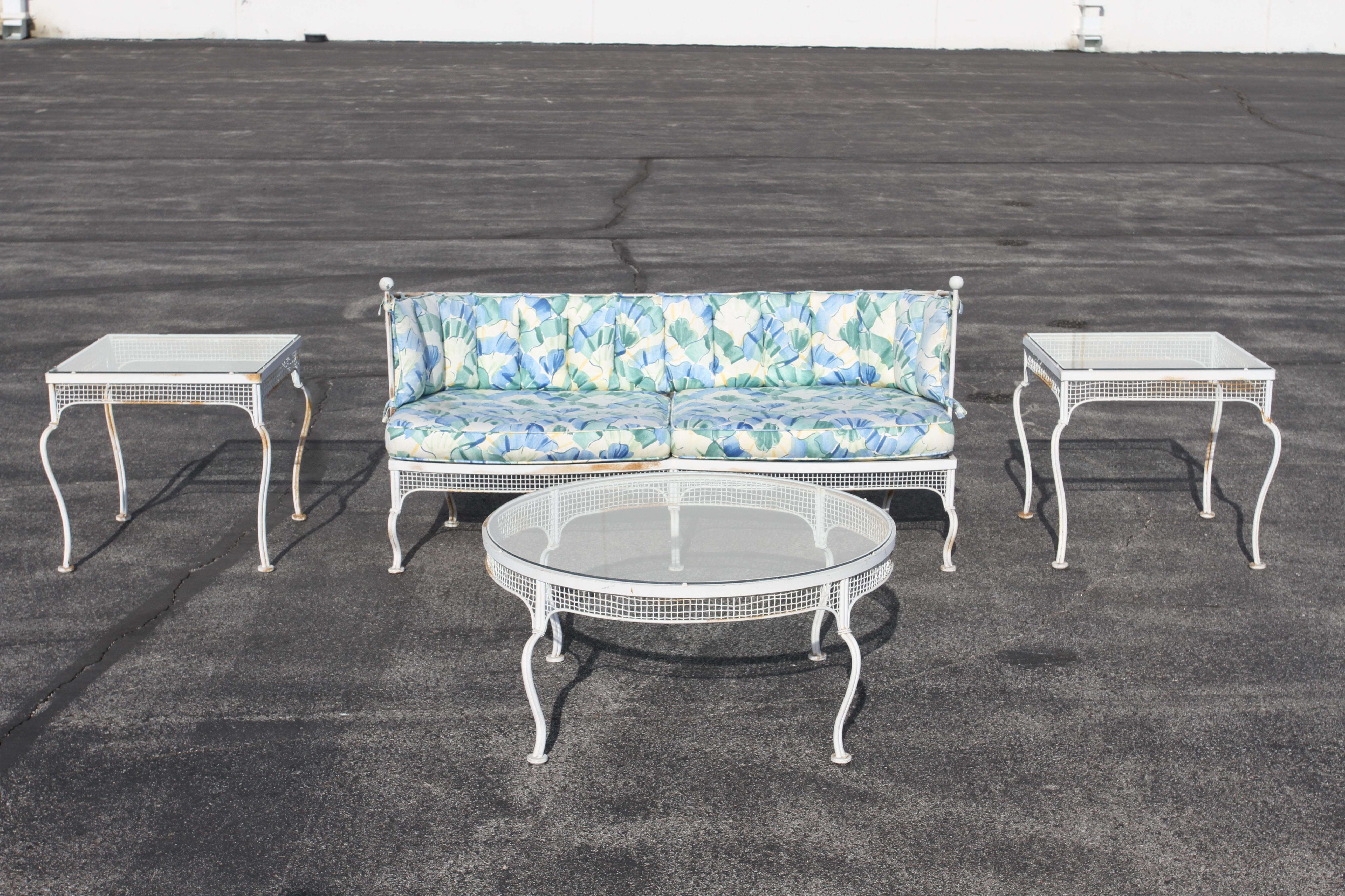 Classic and Rare 1950s midcentury Palm Beach Style outdoor wrought iron and mesh patio / garden round glass top coffee table by Woodard Furniture Co. Part of a original set I'm offering for sale, see the matching tub / lounge chairs & table, end