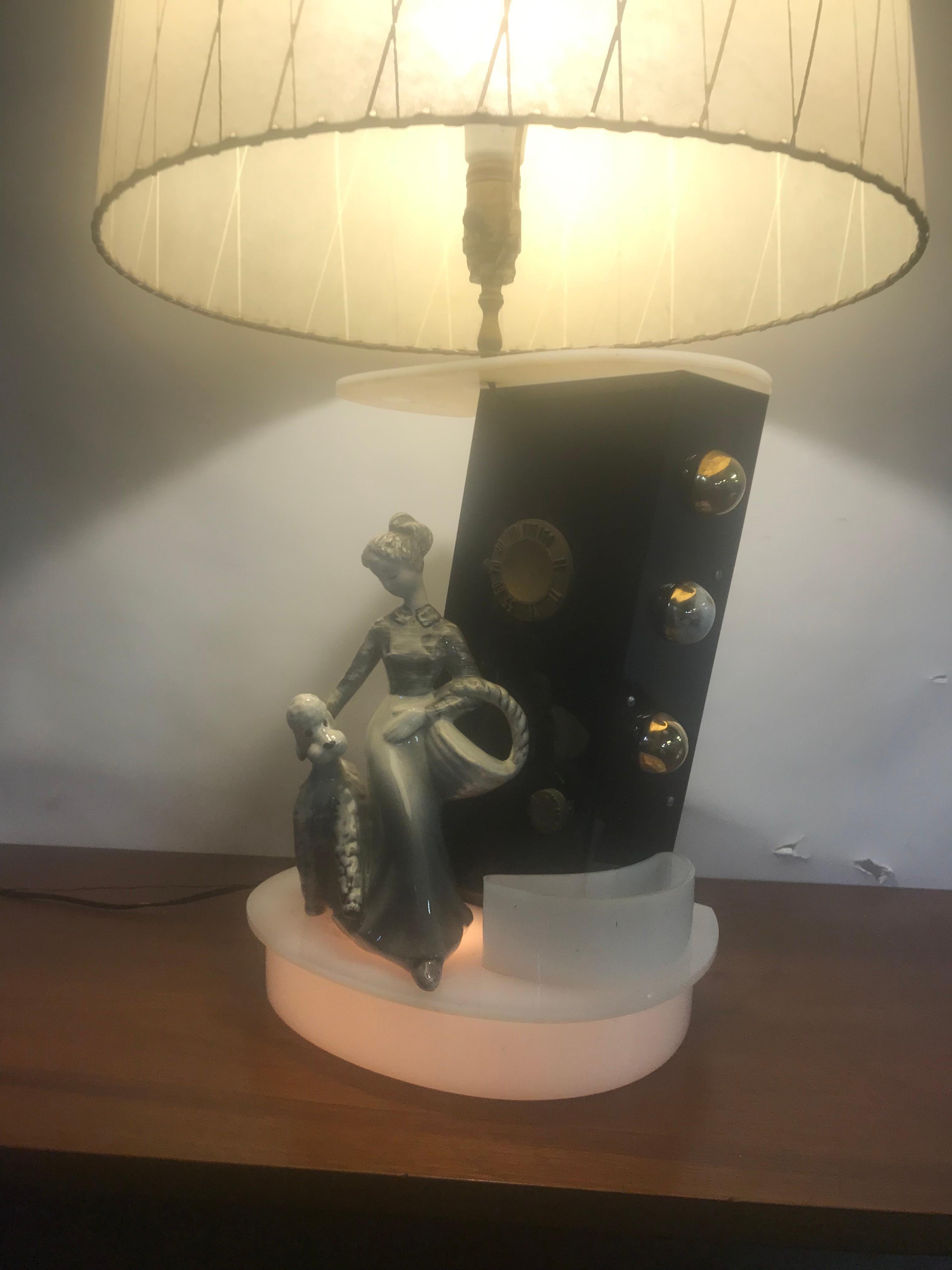 Extremely Rare 1950s MOSS Radio lamp, black and white acrylic. Ceramic woman with poodle made by Hedi Schoop, working radio, B & W acrylic, retains original white acrylic finial. Classic Mid-Century Modern design. Truly a piece of art sculpture.