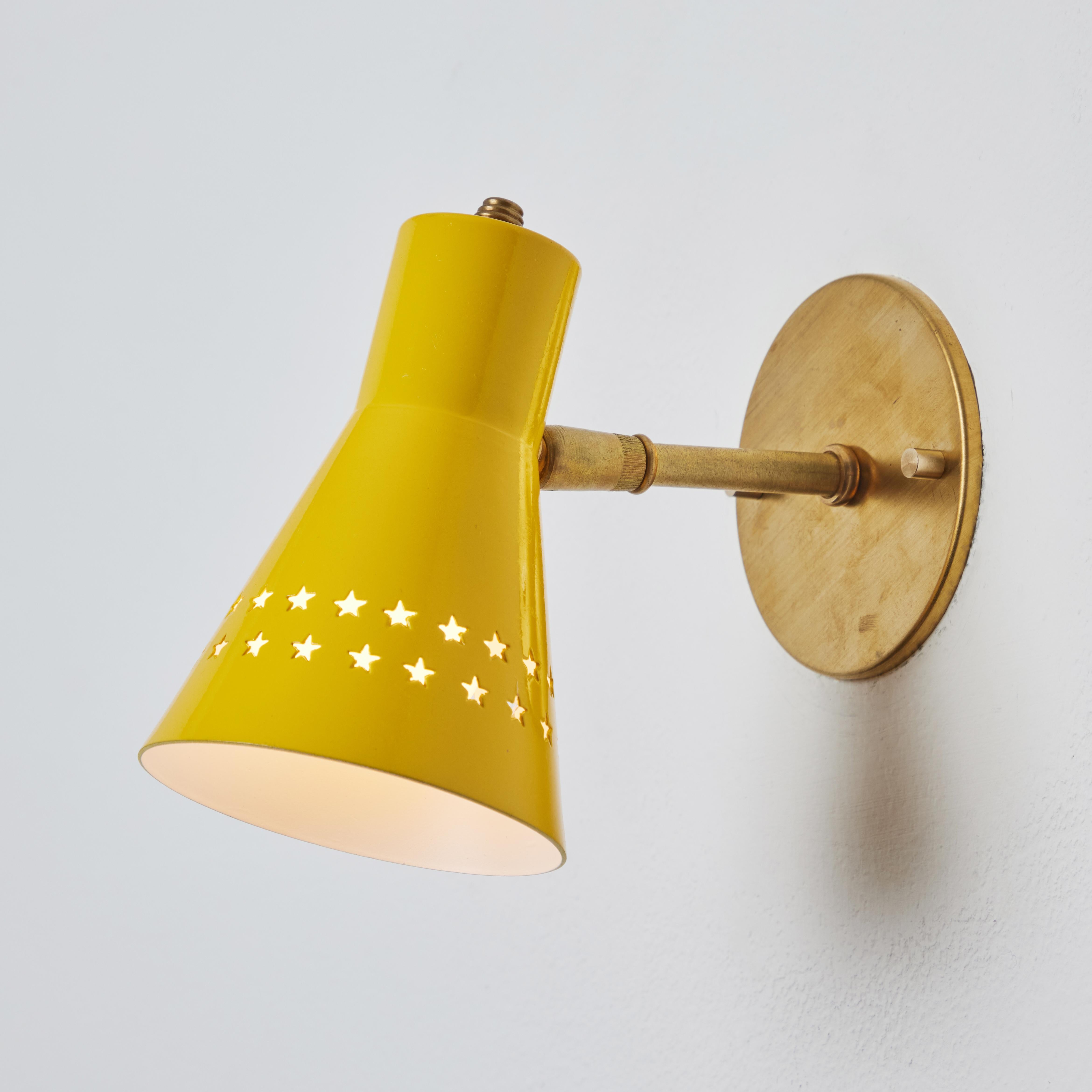 French Rare 1950s Robert Mathieu Perforated Yellow Metal and Brass Wall Sconce For Sale