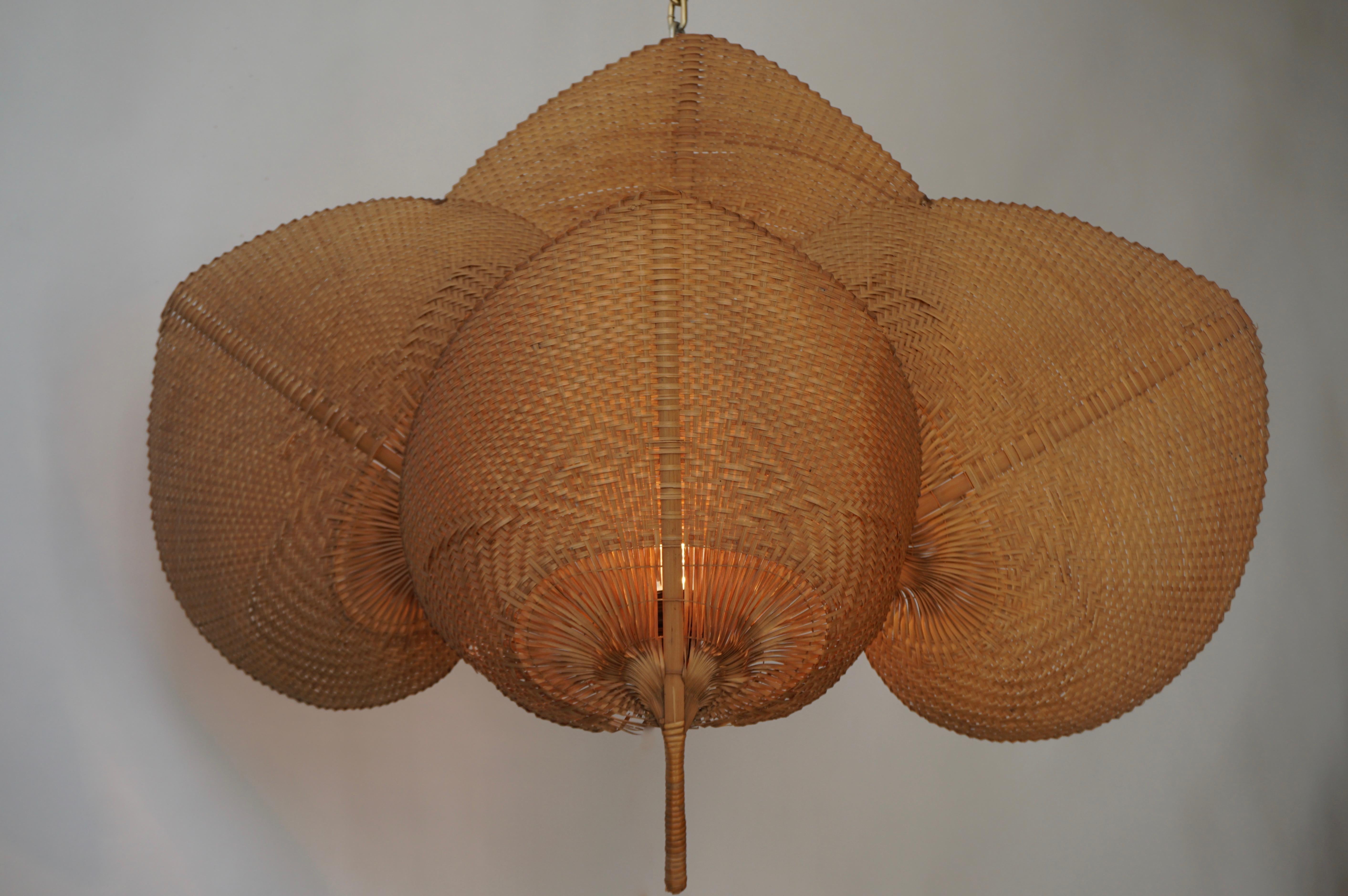 Rare and large 1950s wicker wall light in the style of Ingo Maurer.
These lamps were handmade from bamboo and wicker. They are very fragile and therefor very hard to find in good condition.
The lamp are connected to the wall by a metal wire