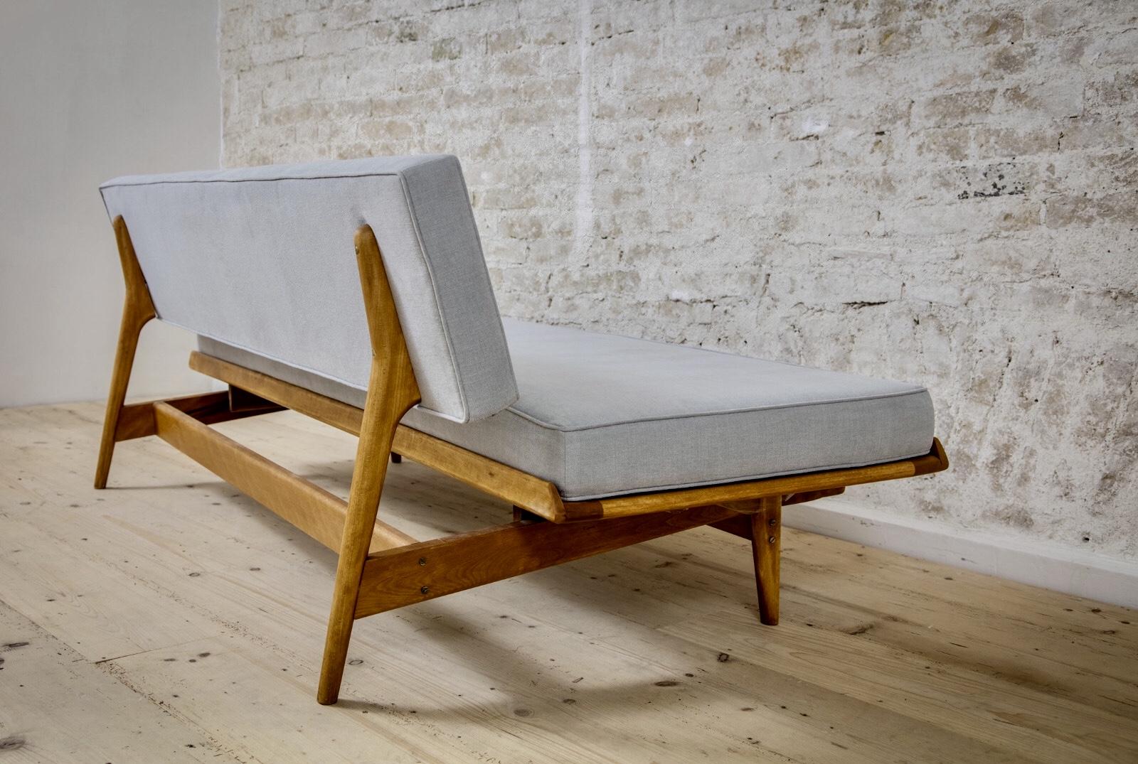 This elegant and rare daybed was designed by the Swedish Designer Karl-Erik Ekselius for Joc Sweden, fully restored. The frame of massive teak has an organic shaping. The upholstery was completely renewed and covered with a high quality cotton/linen