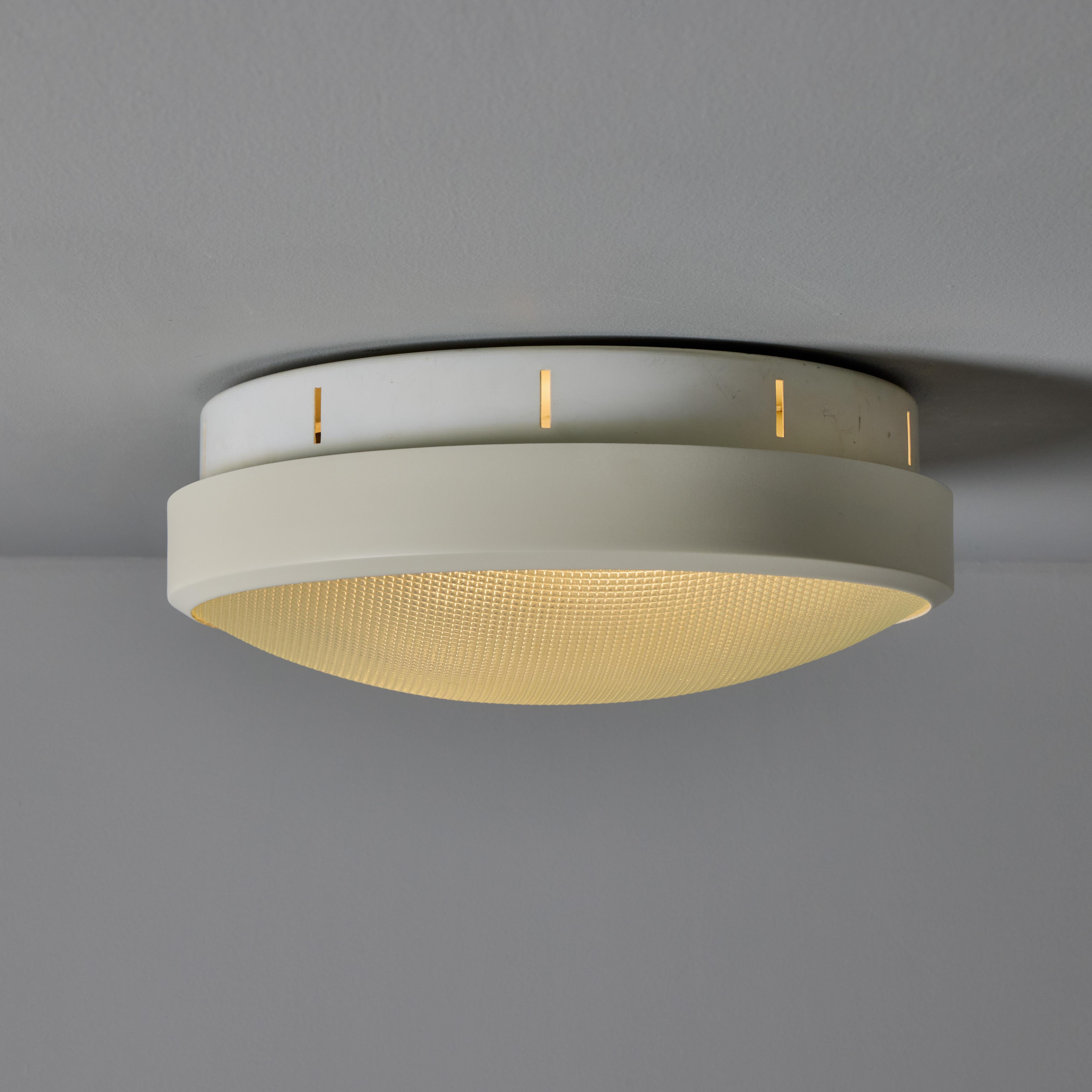 Rare 1960s G.C.M.E. Metal & Textured Glass Flush Mount. Executed in white painted metal with pressed textured glass diffuser. A highly functional and sculptural flush mount of attractive scale and incomparable refinement, highly characteristic of