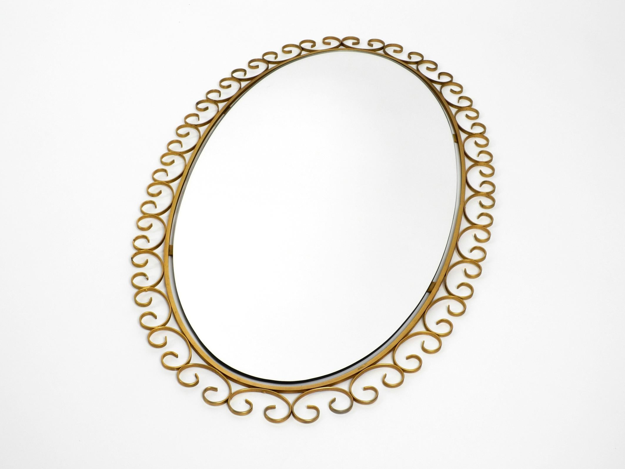 Mid-Century Modern Rare 1960s Large Oval Sunburst Wall Mirror Made of Metal in Brass Anodized