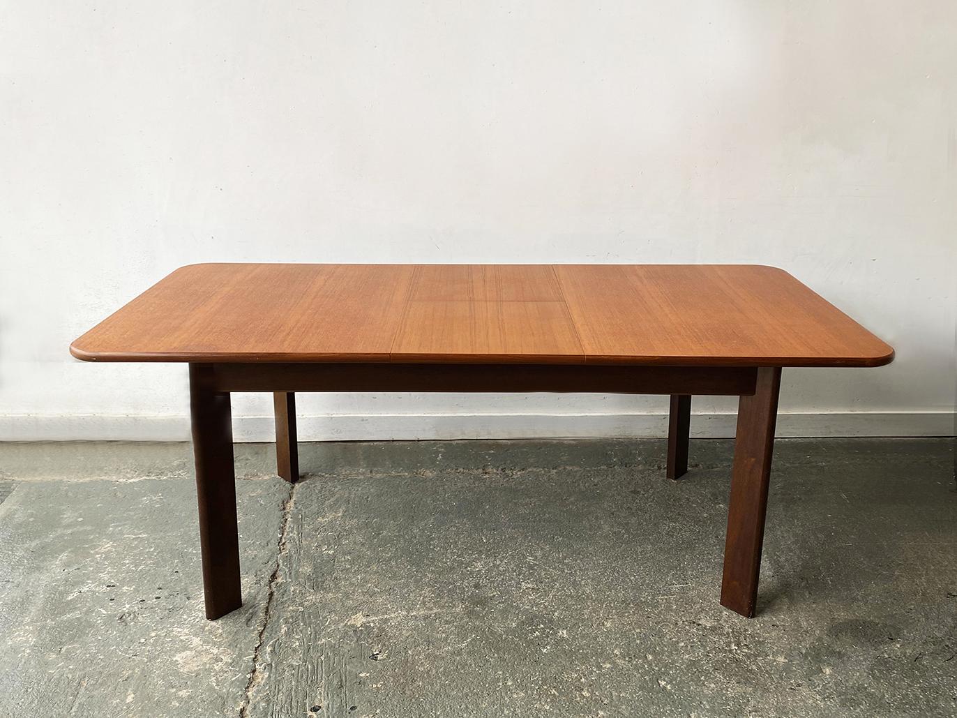 A distinctive, rare G Plan extending dining table. Breaking from their typical aesthetic, this piece shows the influence of Danish design and their collaborations with Danish designers such as Kofod Larsen.

The table has a substantial presence with