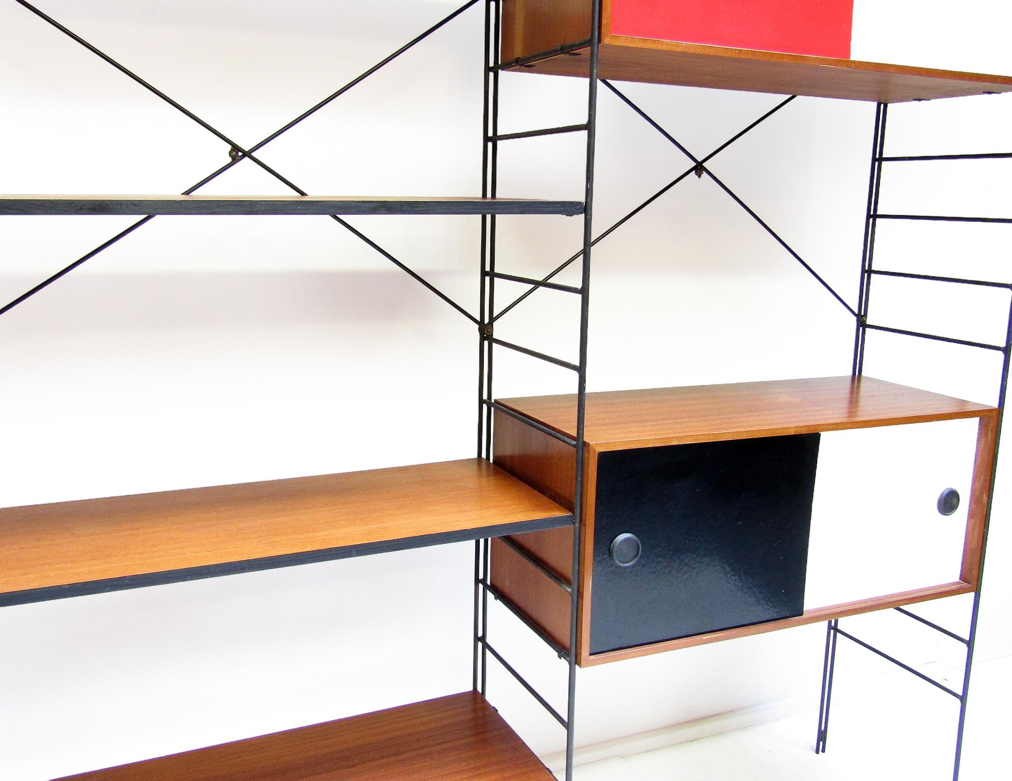 A rare 1960s modular shelving system by Brianco.

Similar to Charles Eames designs, this versatile unit can be used as a room divider or placed against a wall. All shelves and cupboards can be arranged to suit their desired function.

The four teak