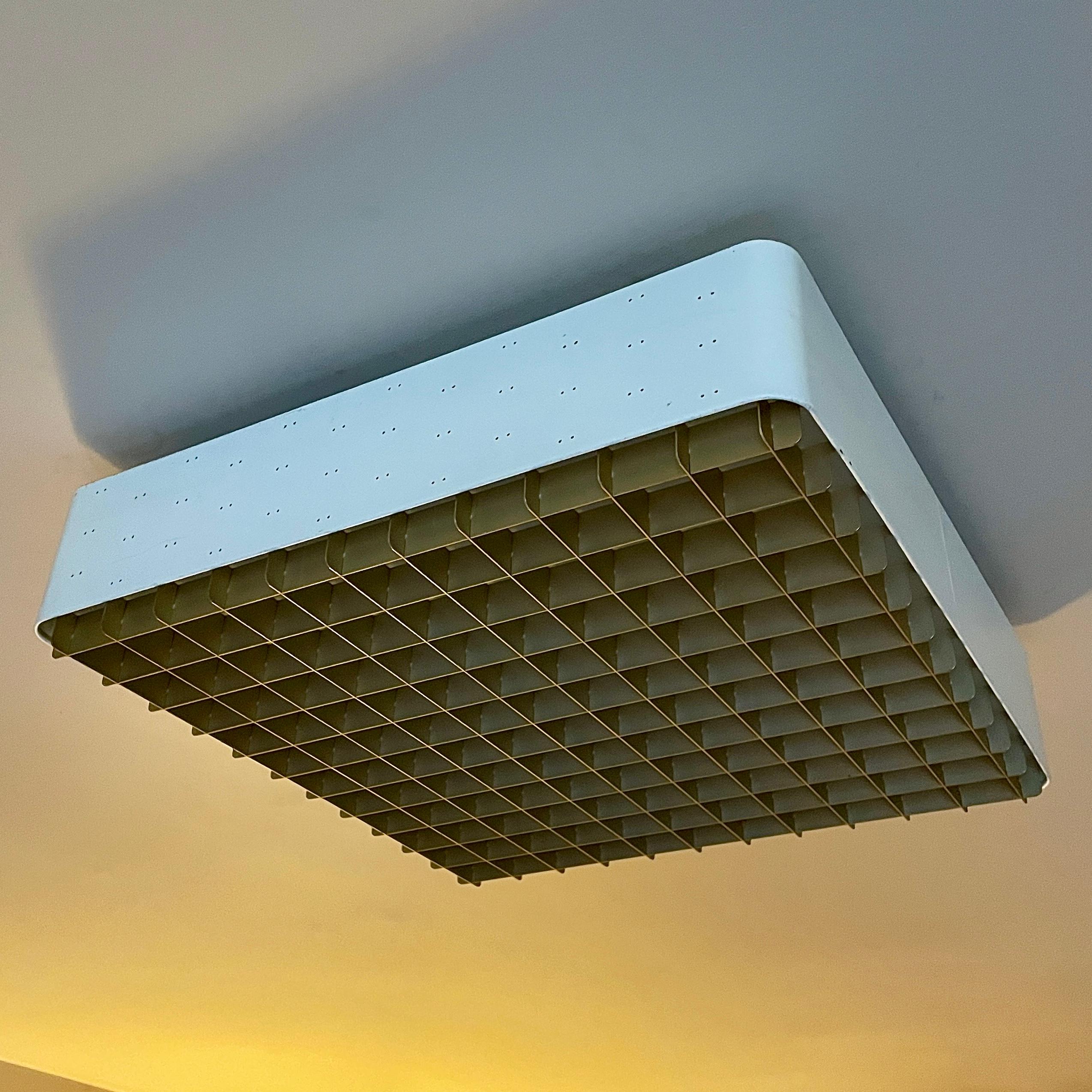 Ready to be hardwired, with normal US 110v voltage. Houses 4 incandescent bulbs. 

This is a large 18x18 square “starry sky” ceiling lamp model #9068 by Paavo Tynell for Lightolier. Lacquered white perforated metal frame, anodized gold grid, and a