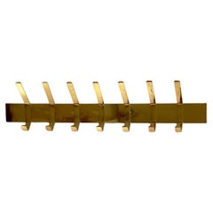 Rare 1960s Robust mid century finnish design coat rack in patinated brass.