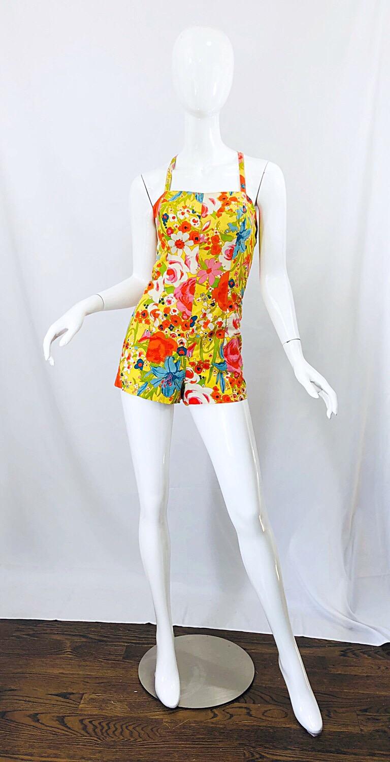 Rare early 60s TINA LESER one piece cotton play suit, roper swimsuit! One of the many great aspects about this piece is that it can be worn for so many different occasions. Yellow background, with flowers printed in vibrant tones of orange pink,