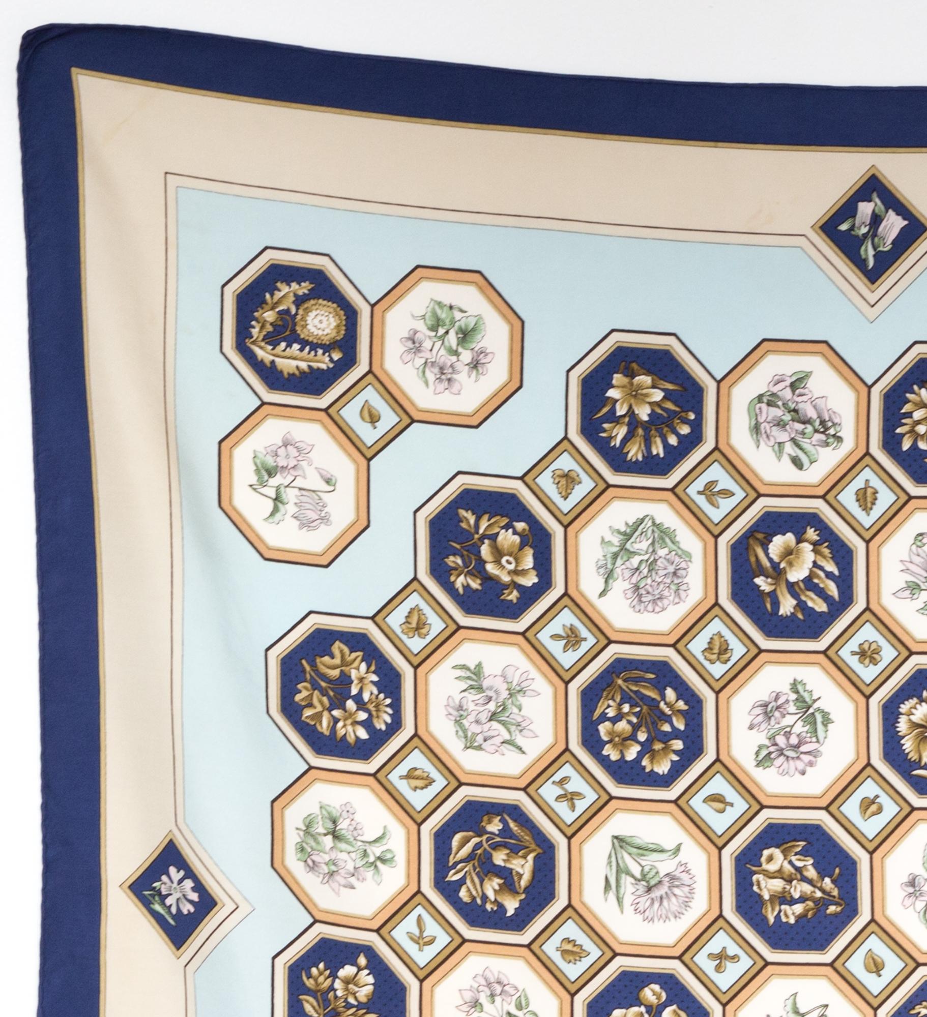 Rare Hermes silk scarf Carrelages by Maurice Tranchant featuring a navy border, a top logo signature. 
In good vintage condition. Made in France.
Only one issue: 1968
35,4in. (90cm)  X 35,4in. (90cm)
We guarantee you will receive this  iconic item