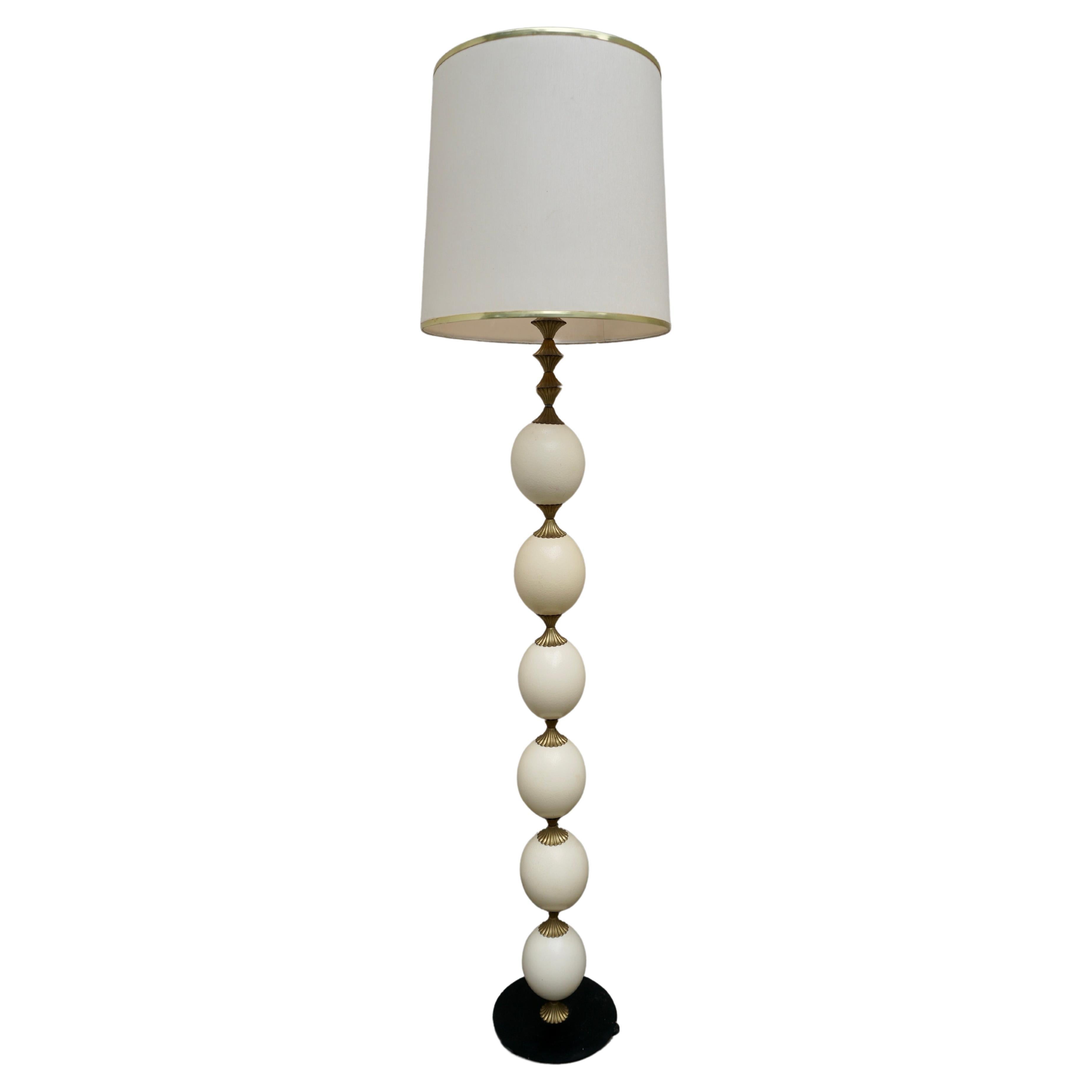 A stunning Hollywood Regency style lamp in brass, quite substantial and will surely be a conversation piece in any home.

Note: Lamp height without shade to top of socket is 55.1 inches tall. 

Diameter shade 15.7