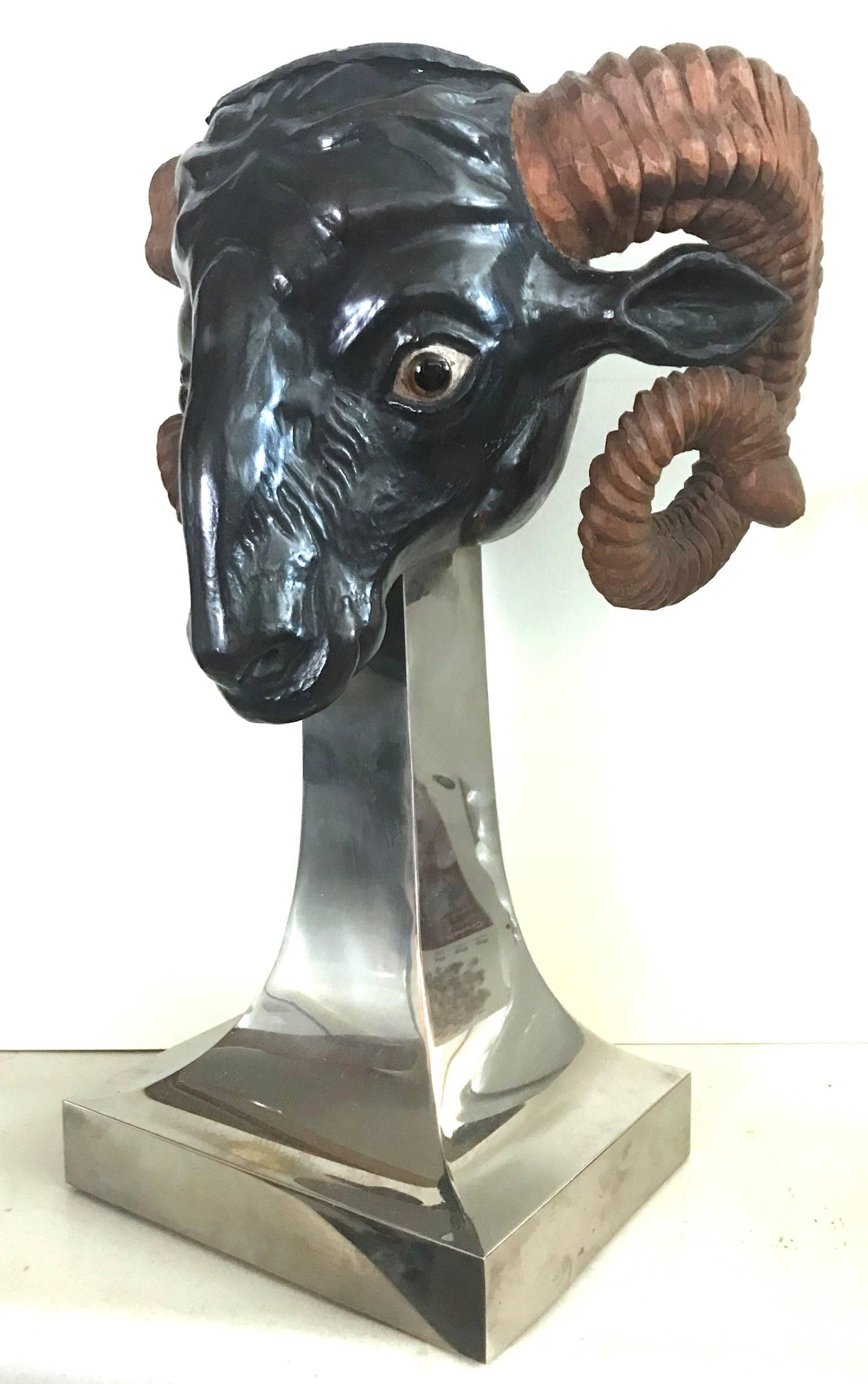 Rare 1970s carved wood ram’s head with polychrome decoration mounted on sculpted chrome stand by Anthony Redmile, England.