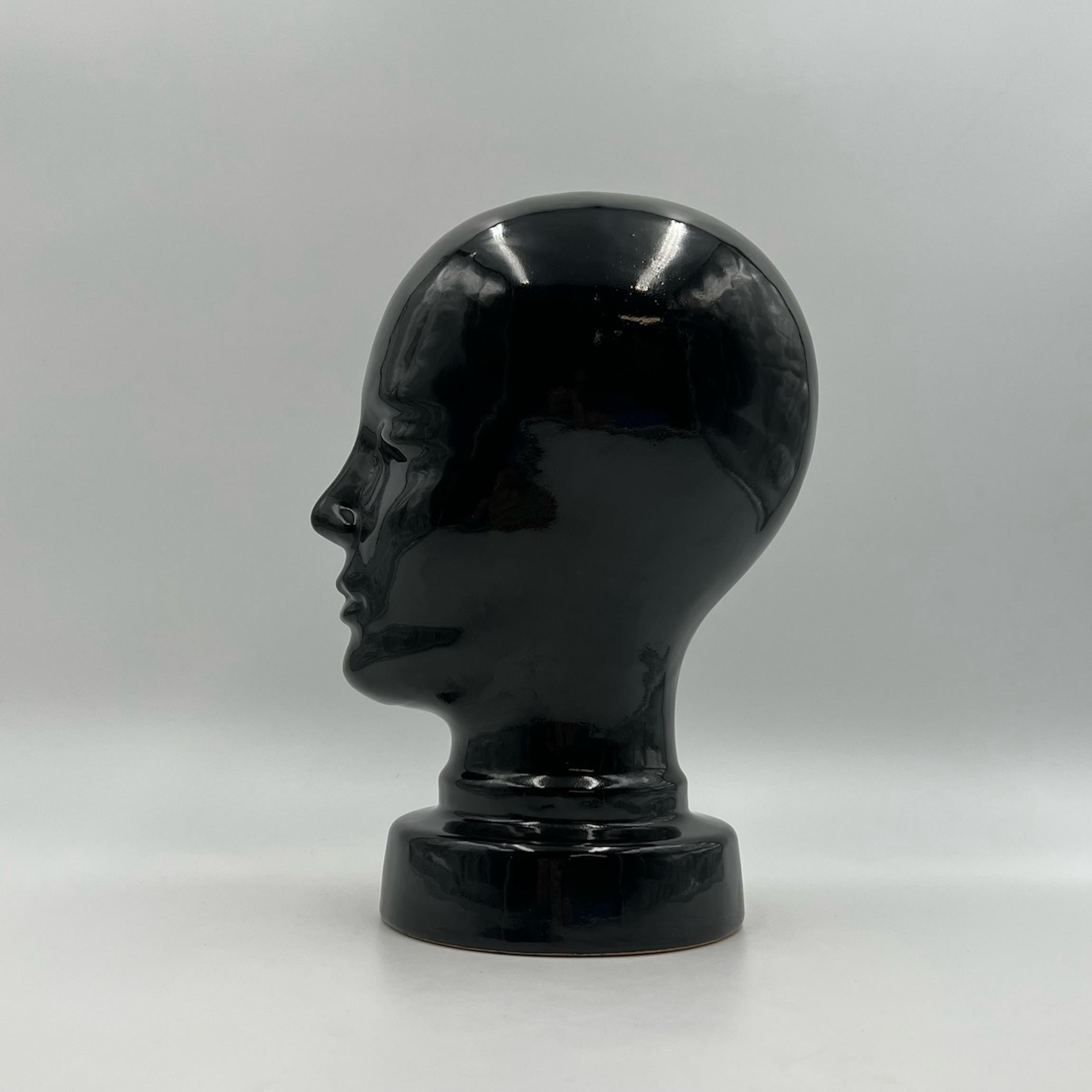 Rare vintage ceramic head, produced in West Germany in the 70s, made of glossy black glazed ceramic. A great piece of craftsmanship, with delicate and and realistic details, that will give a distinctive touch to any room.  

In excellent condition,