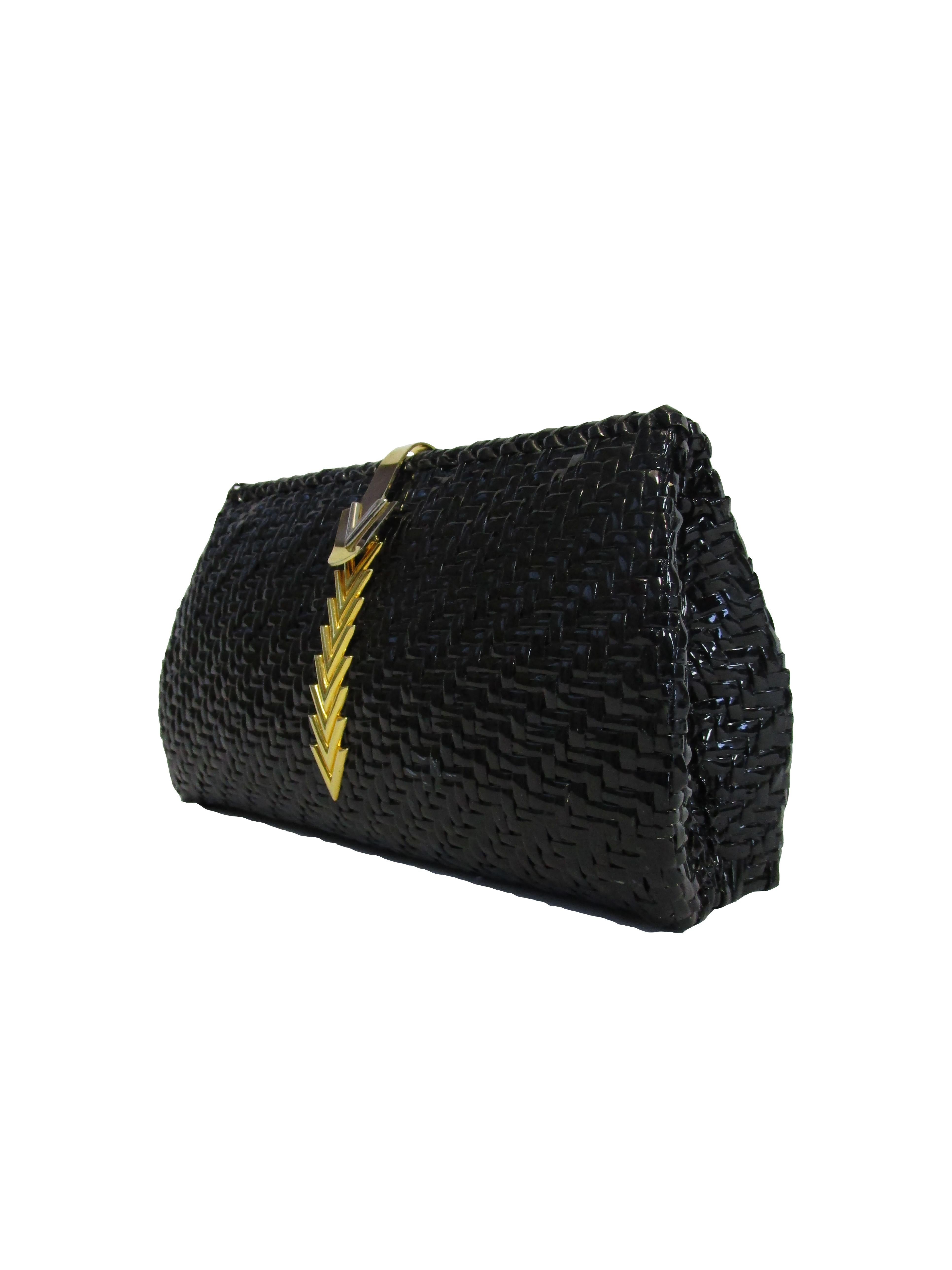 
Resort Season Perfection boasts this Sleek and Chic Black Wicker clutch by Mario Valentino! This bag features a glazed exterior with a classic gold accented 