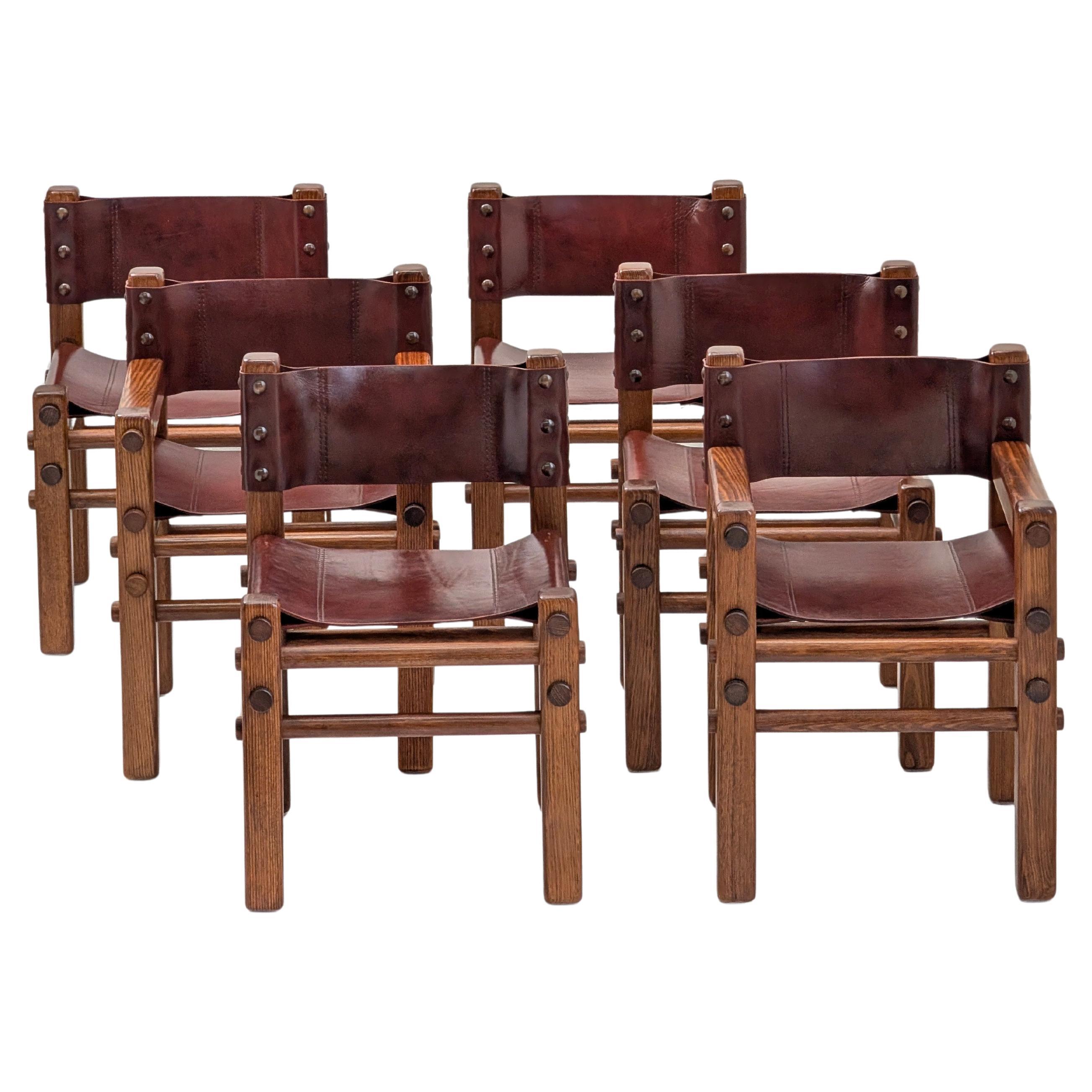 Rare sedie da pranzo con schienale in pelle Norman Archibald
Nore
degli anni
70 (set di 6)