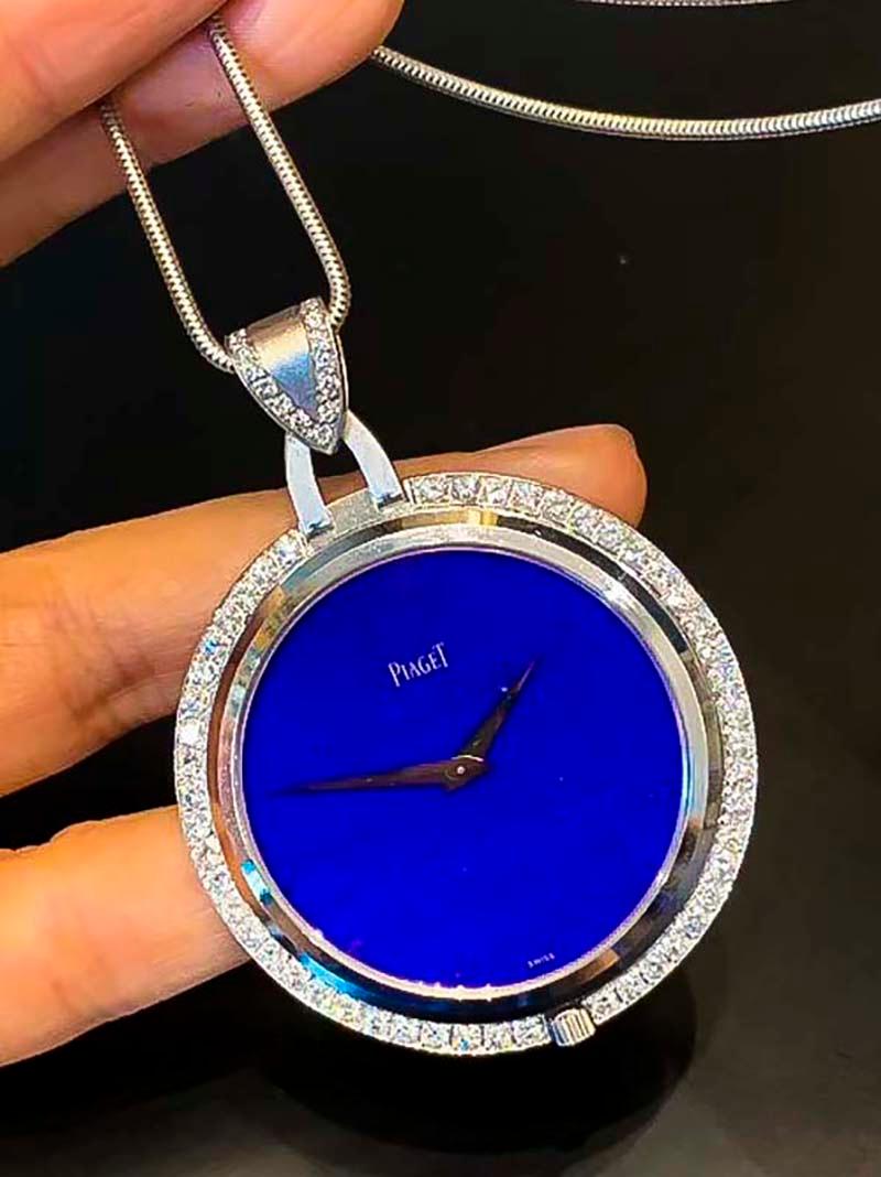 A very limited production Piaget circa 1970s in 18kt White Gold  Diamond Set bezel Lapis Dial Pendant Watch, fully signed with Piaget certificate of authenticity

Basic Specifications & Special Features
- 42mm approximately circumference excluding