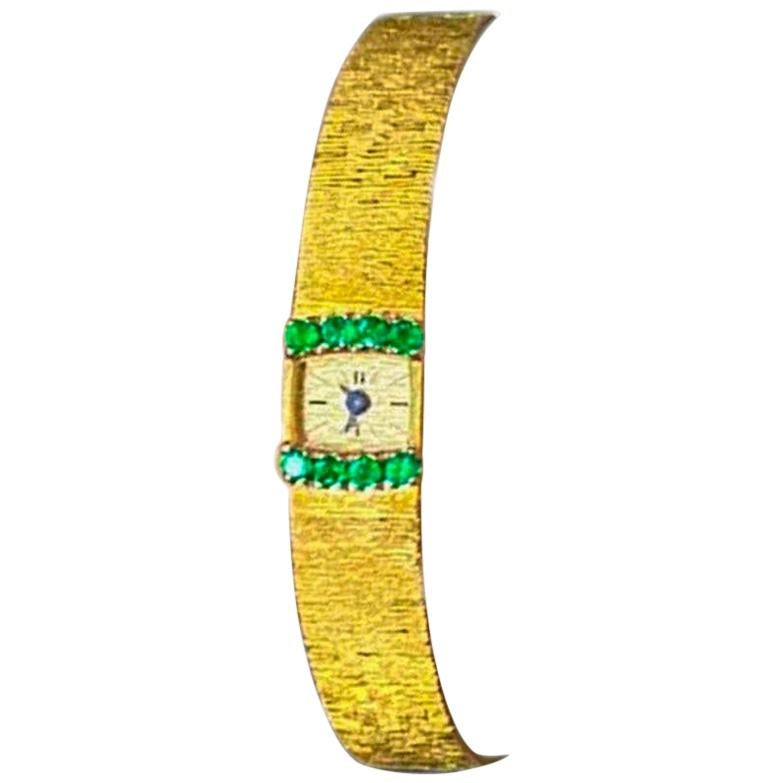 1970s Piaget Emerald 18 Karat Yellow Gold Line Bracelet Watch For Sale