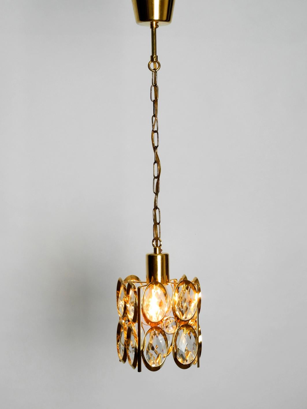 Rare beautiful 1970s Palwa brass pendant lamp with faceted crystal stones.
High-quality work, frame and sockets made of brass. Produced by Pawla in the 1970s. Made in Germany. Great rare design for very pleasant illumination with one E27