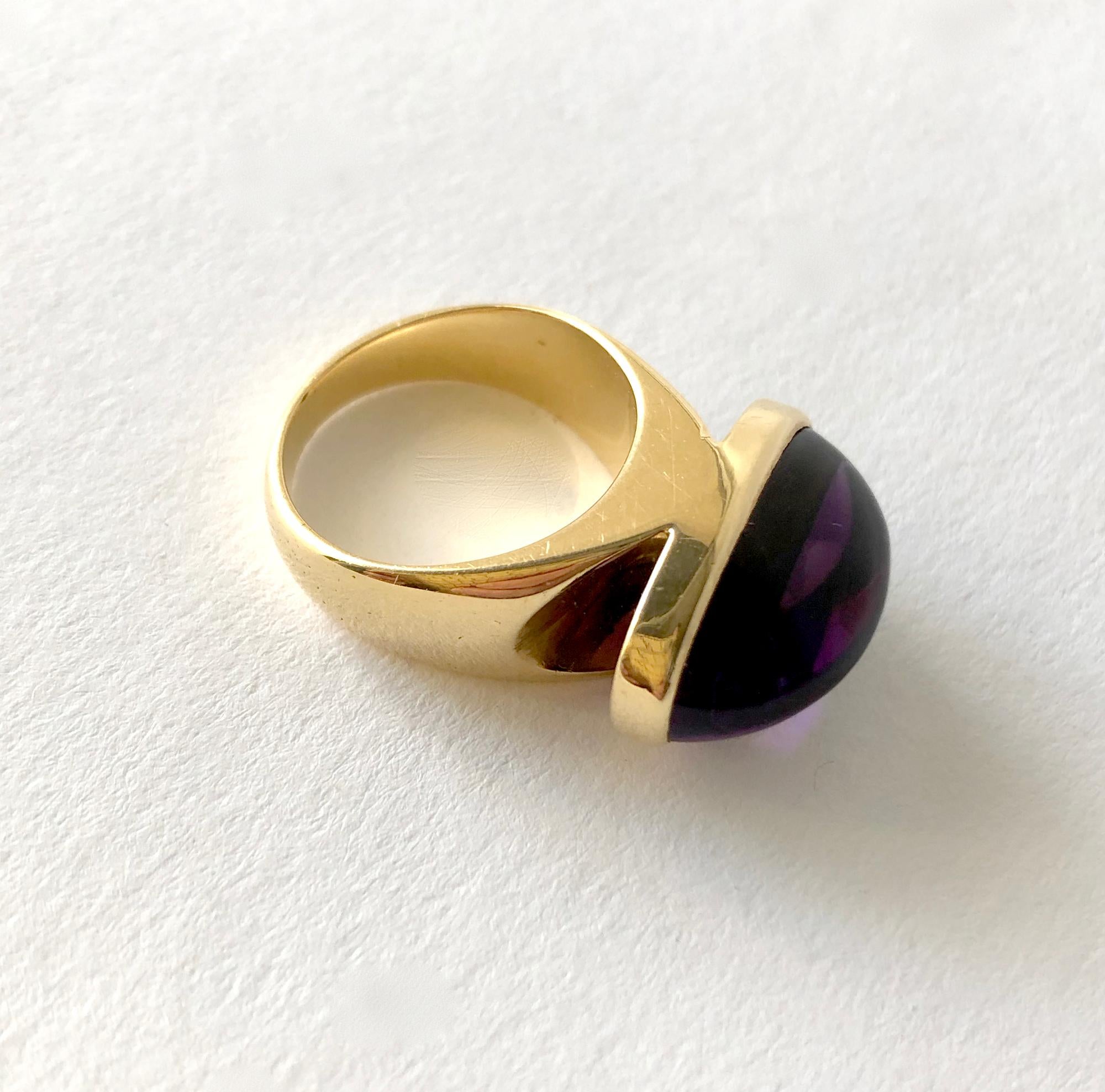 Rare, 18 karat gold ring with oval amethyst cabochon created by goldsmith Tuk Fischer for Georg Jensen, circa 1970's.  Ring is a finger size 6 to 6.25.  Signed Georg Jensen, 1096, Denmark, 18K, 750.  In very good vintage condition. 12.2 grams.