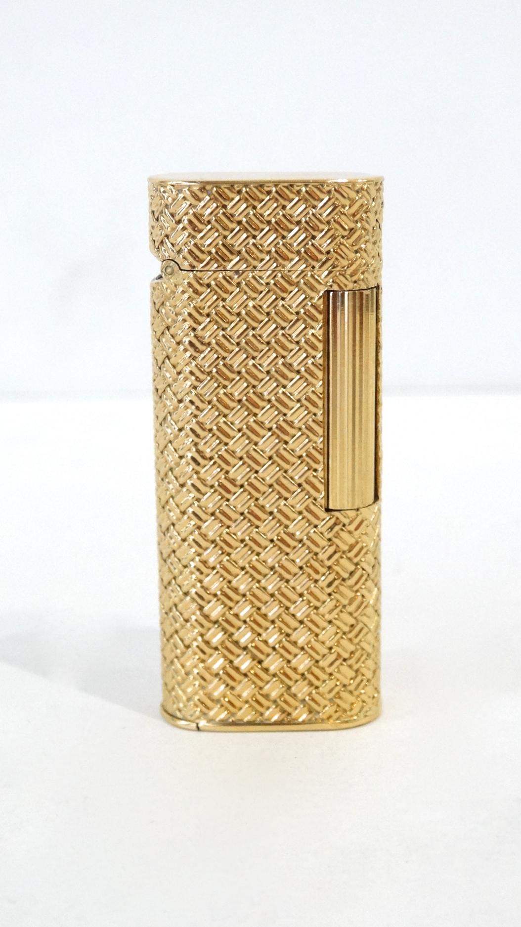 Rare 1970s Dunhill for Van Cleef & Arpels 18K Gold gas lighter. Features a woven basket pattern, new flint and flip top. Stamped Dunhill/ Van Cleef & Arpels, serial number 100247 and 750 for solid 18K Gold. Great working condition. Total weight 89