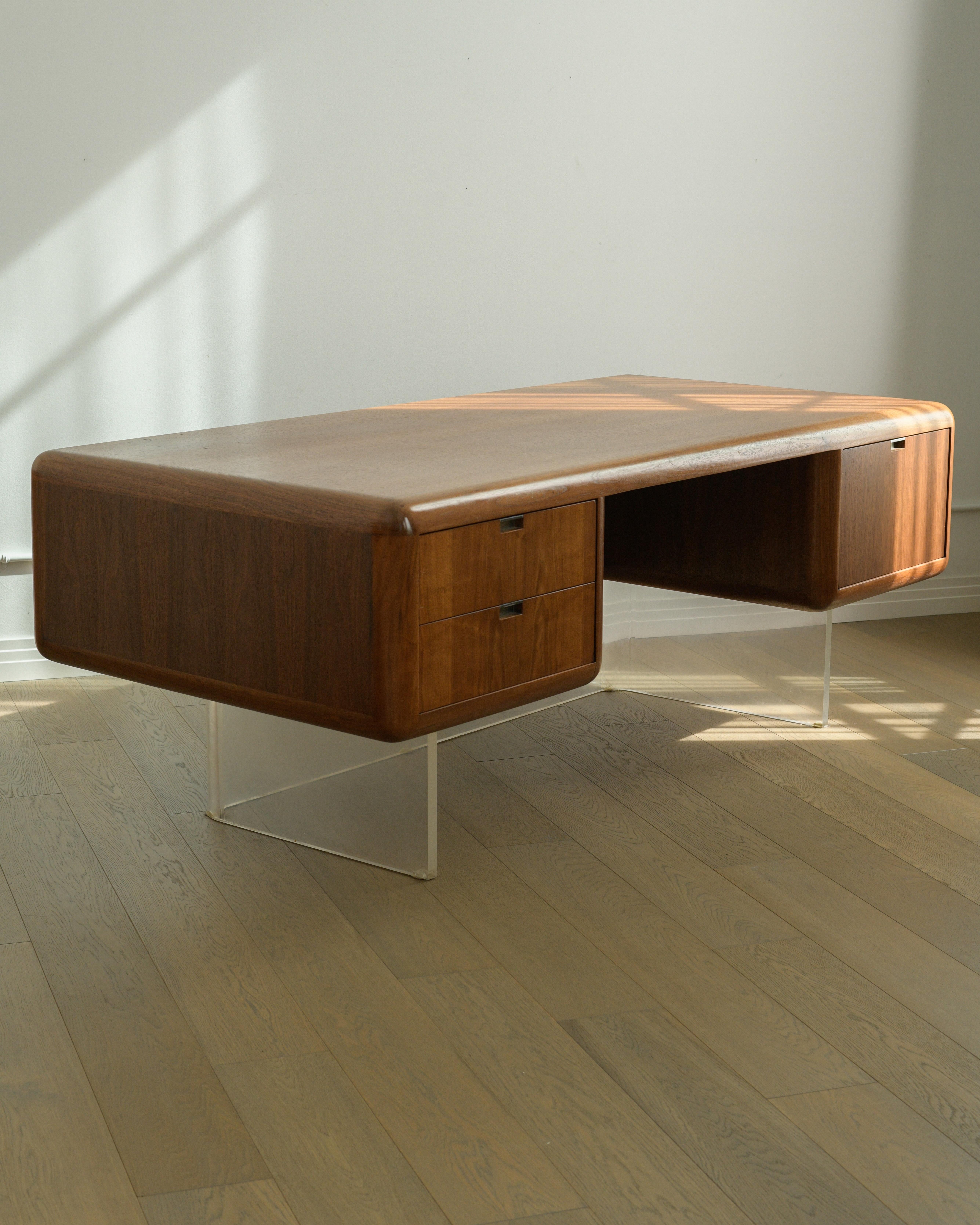 Extremely Rare and Monumental 1970s Floating Walnut & Lucite Executive Desk by Vladimir Kagan.

Beautiful solid walnut bullnose edging, two smaller drawers on the left side with internal organizing elements for smaller items on top drawer and one