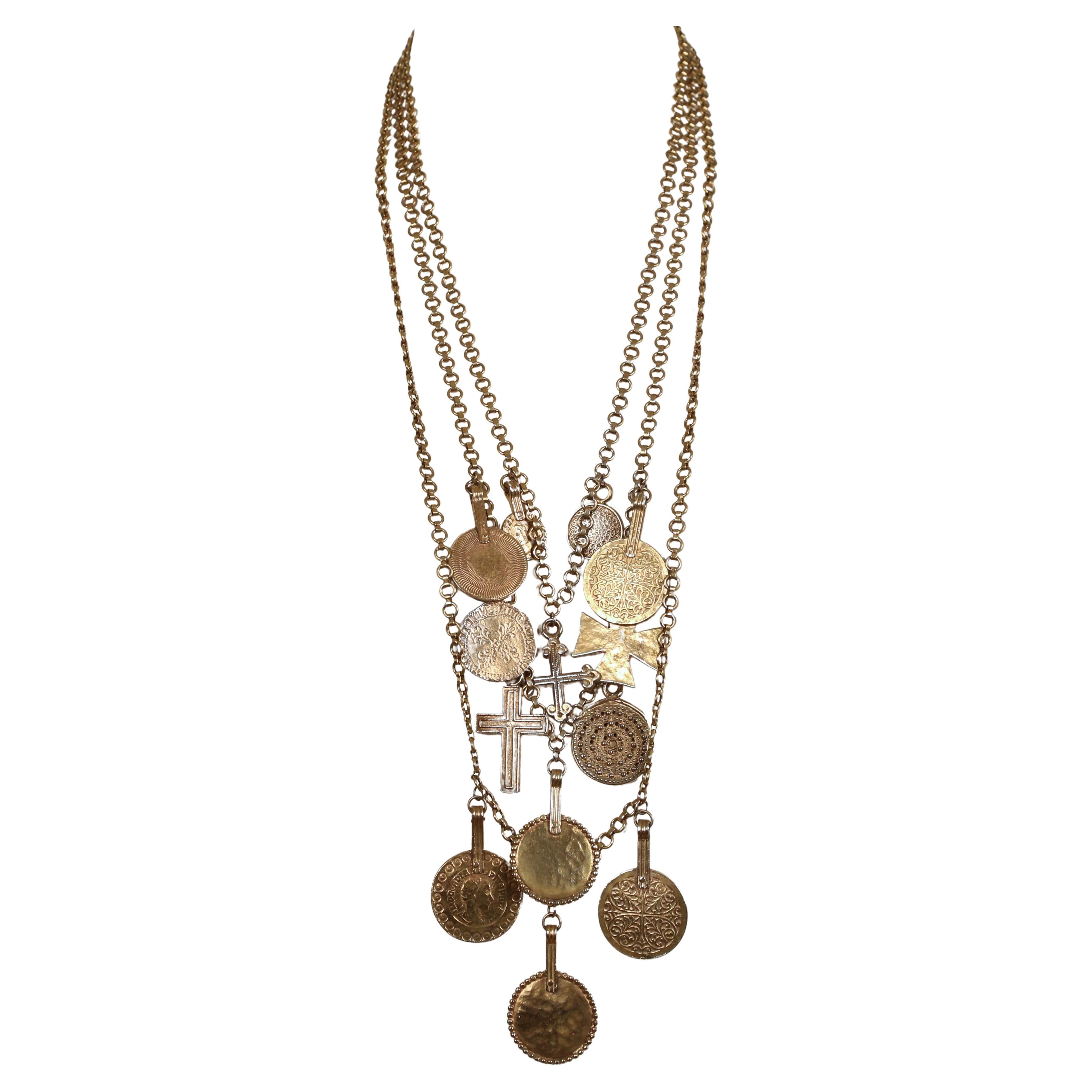 Very rare, antiqued Roman coin and cross necklace from Yves Saint Laurent dating to 1977 exactly as seen on the spring runway.  A very similar Saint Laurent necklace was photographed on Farrah Fawcett. This particular necklace is the extra long