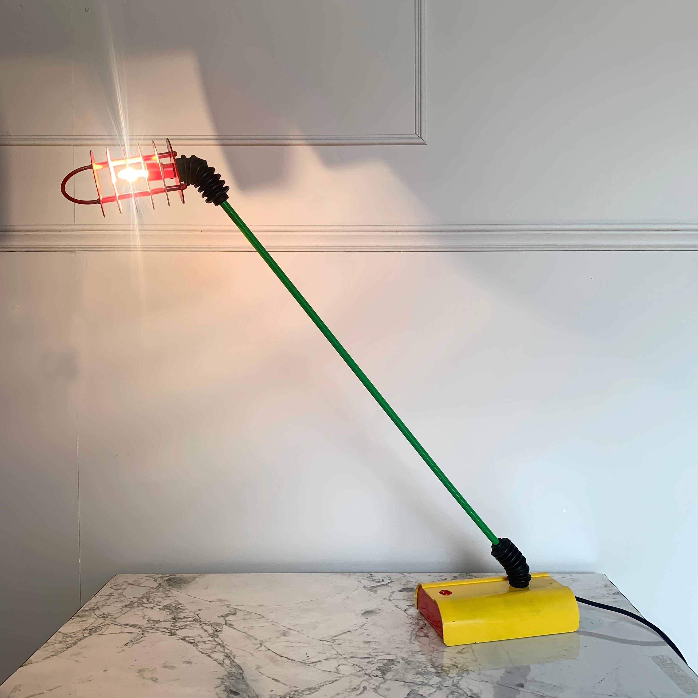 Rare Italian Sottsass style Memphis desk lamp, 1980s
Superb Memphis styling, colors and design lines
This lamp has an adjustable bright green arm with flexible rubber sleeves covering both ends
The rectangular yellow base has contrast primary red
