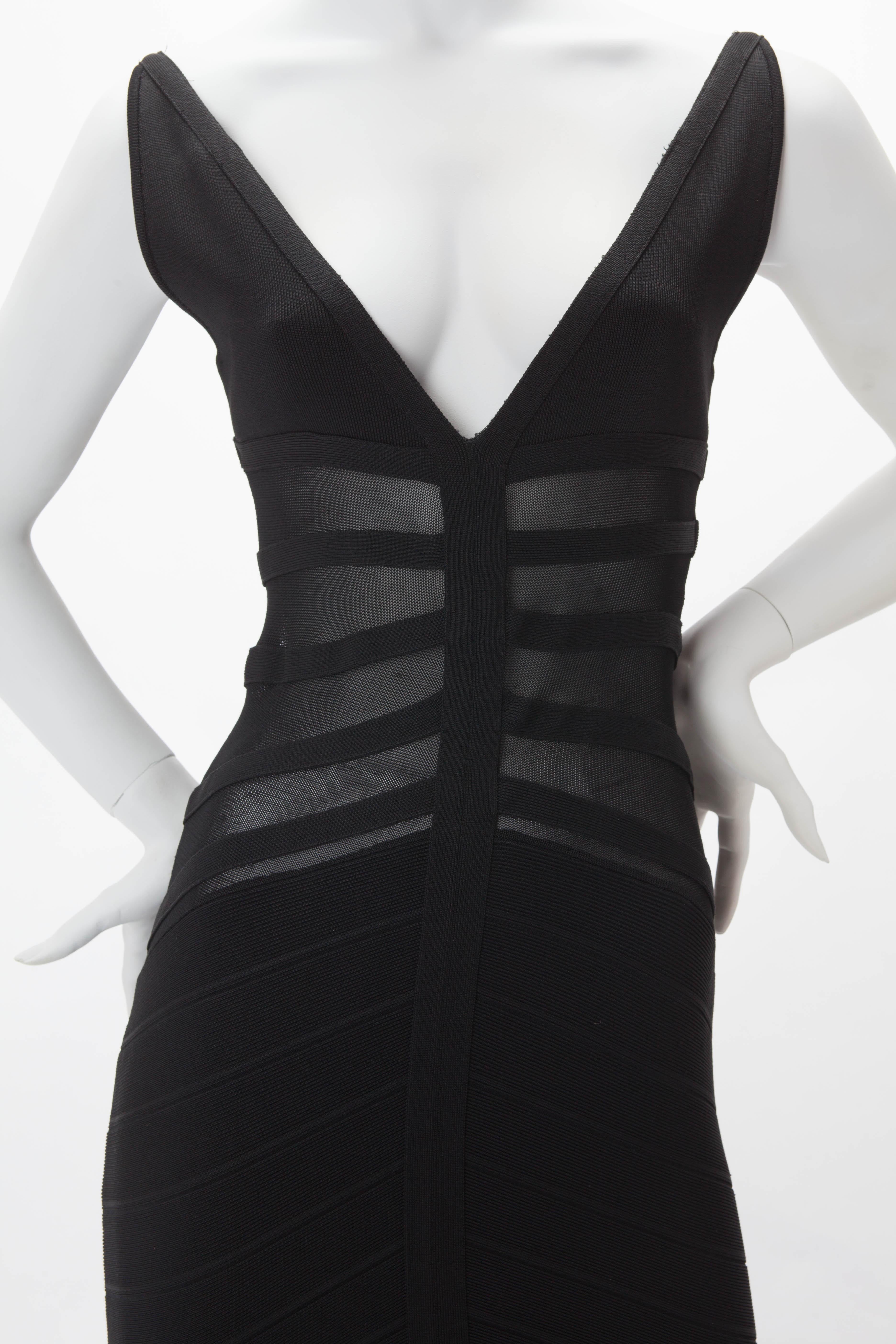 Rare Iconic 1990s Azzedine ALAIA Black Ribbed Lycra and Net Sleeveless Gown; V-Neck with Paneled Bodice; Deep V-back with Single Hook and Eye Strap; Full Length Skirt with Fishtail Hem. Runway Sample. Fits US size 2-4