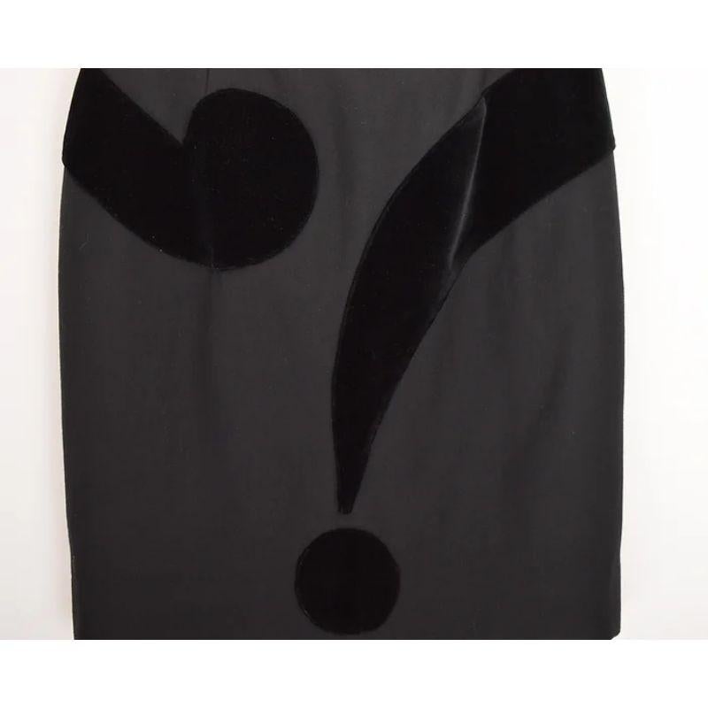 Impeccable, instantly recognisable 1990's Moschino 'Cheap & Chic' label 'Question Mark' appliqué skirt, featuring a high waisted pencil fit with above the knee length hem.

MADE IN ITALY

Features:
Concealed back zip
High waisted fit
Large 'Question