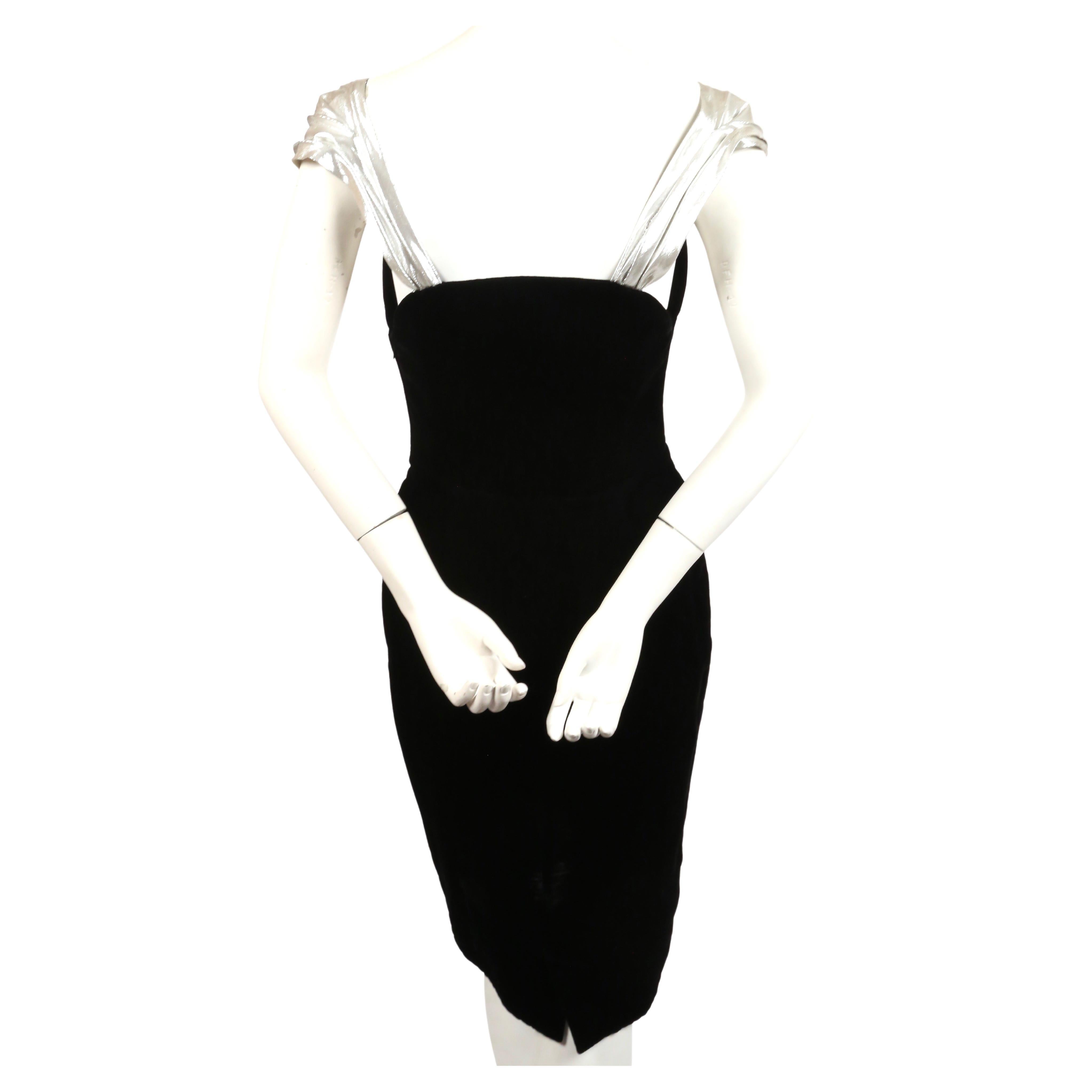 Very rare and dramatic, black velvet dress with shaped 'winged' wire bodice and silver lame detail from Thierry Mugler dating to the 1990's. Neckline wires are adjustable. Dress has a very flattering cut. French size 38. Approximate measurements: