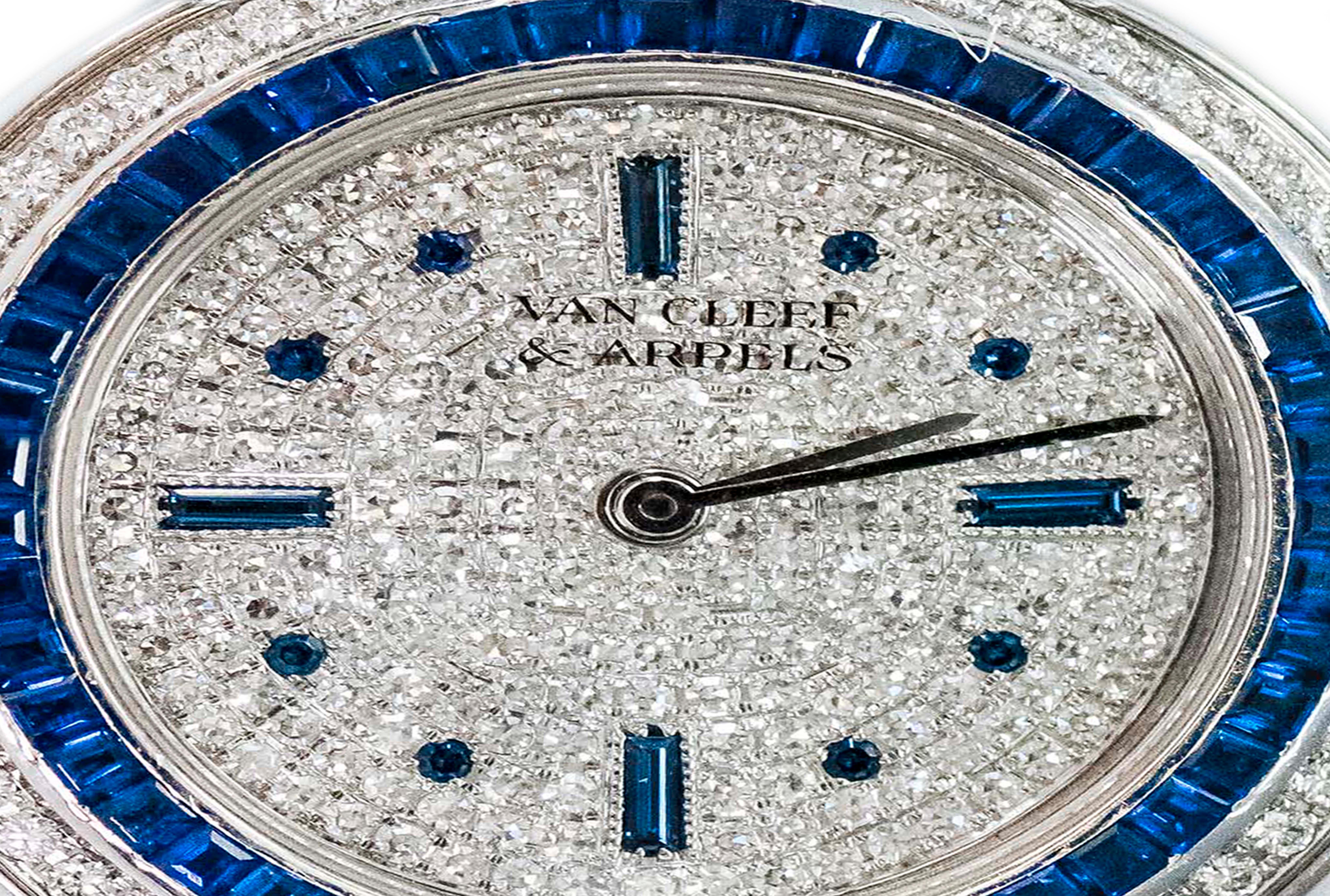 A Rare Limited Edition 1990 Van Cleef & Arpels 18kt White gold Pave Diamond Dial & Channel Set Sapphire Bracelet Watch

Dimensions
* Case dimensions are 31mm x 31mm
* Fits up to a 170mm wrist size
* Fully Signed Case,Dial, Clasp
* Accompanied by Van