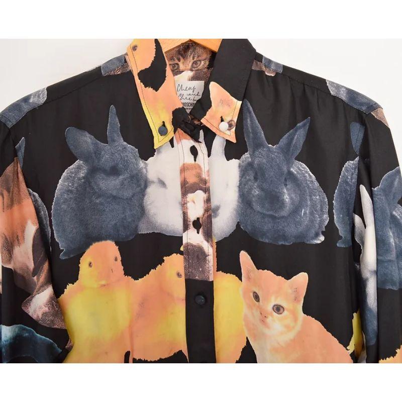 Incredible Vintage 1990's Moschino pure silk shirt in a rare pattern depicting photographic images of household pets (Cats, Dogs, Rabbits etc.)

MADE IN ITALY !

Features:
Central line button fasten
Long sleeves
Cheap & Chic Label
100% Silk

Sizing
