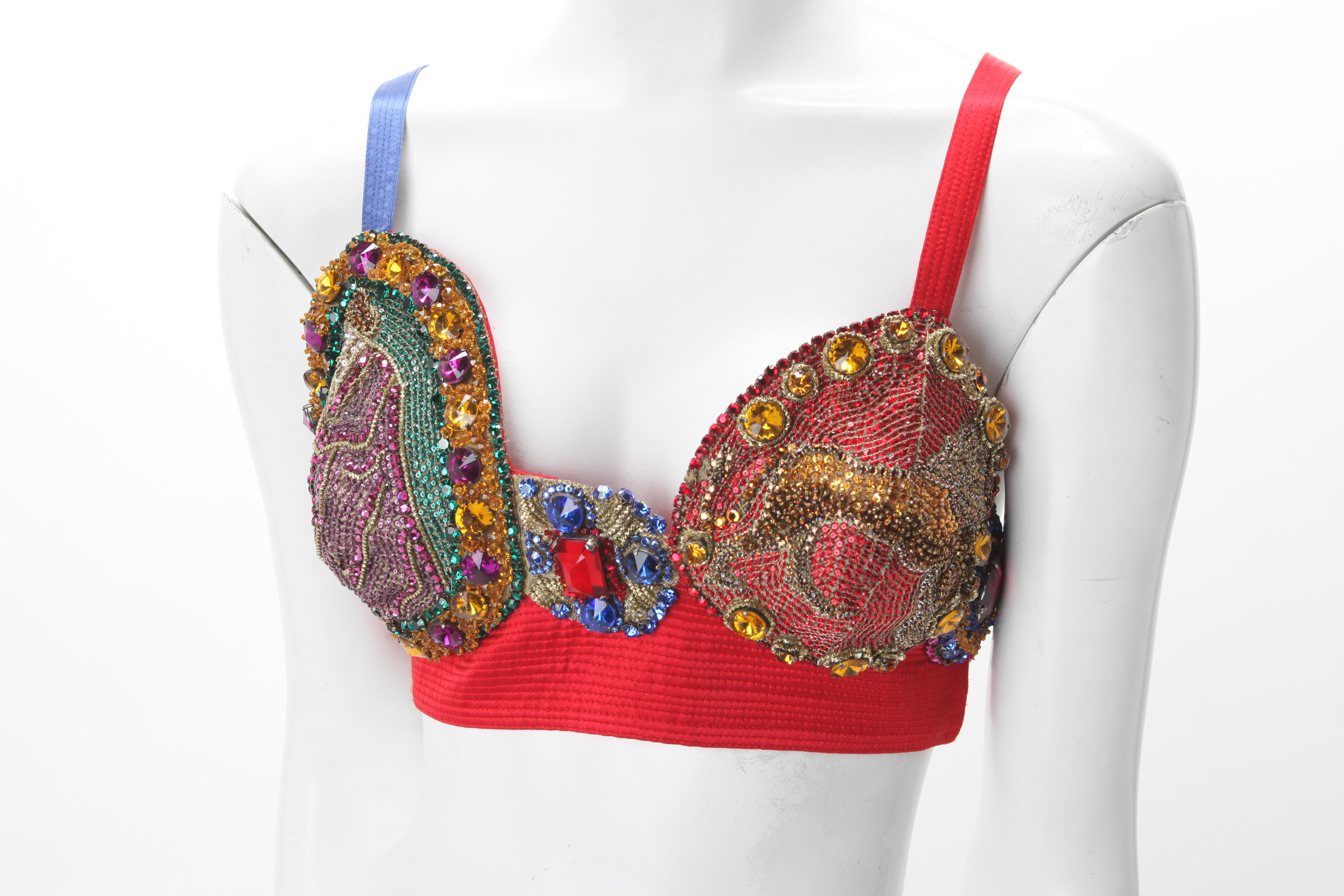 Rare 1991 Gianni Versace Couture Embroidered Bustier with Figural Motifs. Asymmetrica; Red ribbed silk bustier with densely embroidered multi faceted Stones; Color Blocked straps; Hook and closure at side. 