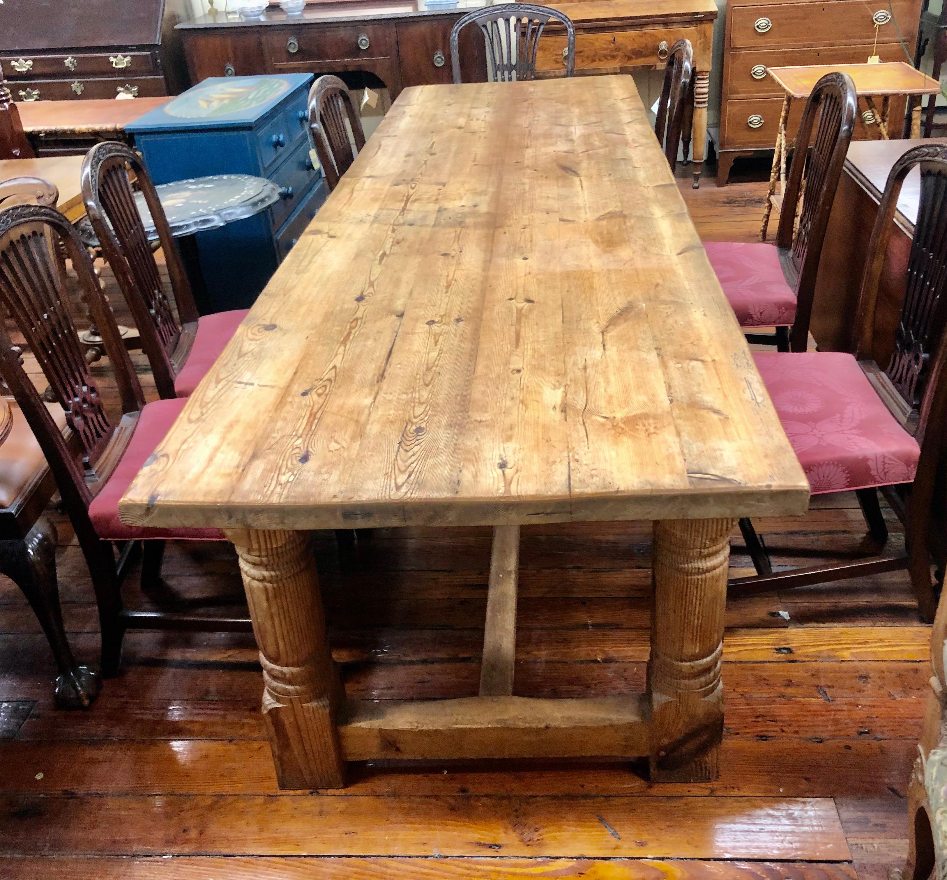 Exceptional antique English unusually long pine farmhouse table with wonderful stretcher base and a 1.5” thick top! Nearly 9.5 feet long and only 34” wide. Has a 28.5” kneehole clearance. Fantastic antique condition. (Top of table may be removed