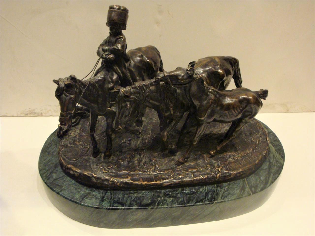 A Beautiful and Rare Original 19th Century Russian Bronze Sculpture by Evgeni Lanceray, Cast bronze figural group. Bronze Showcases a young boy on horseback, with two additional horses, signed, with other markings. Beautifully standing on a Green
